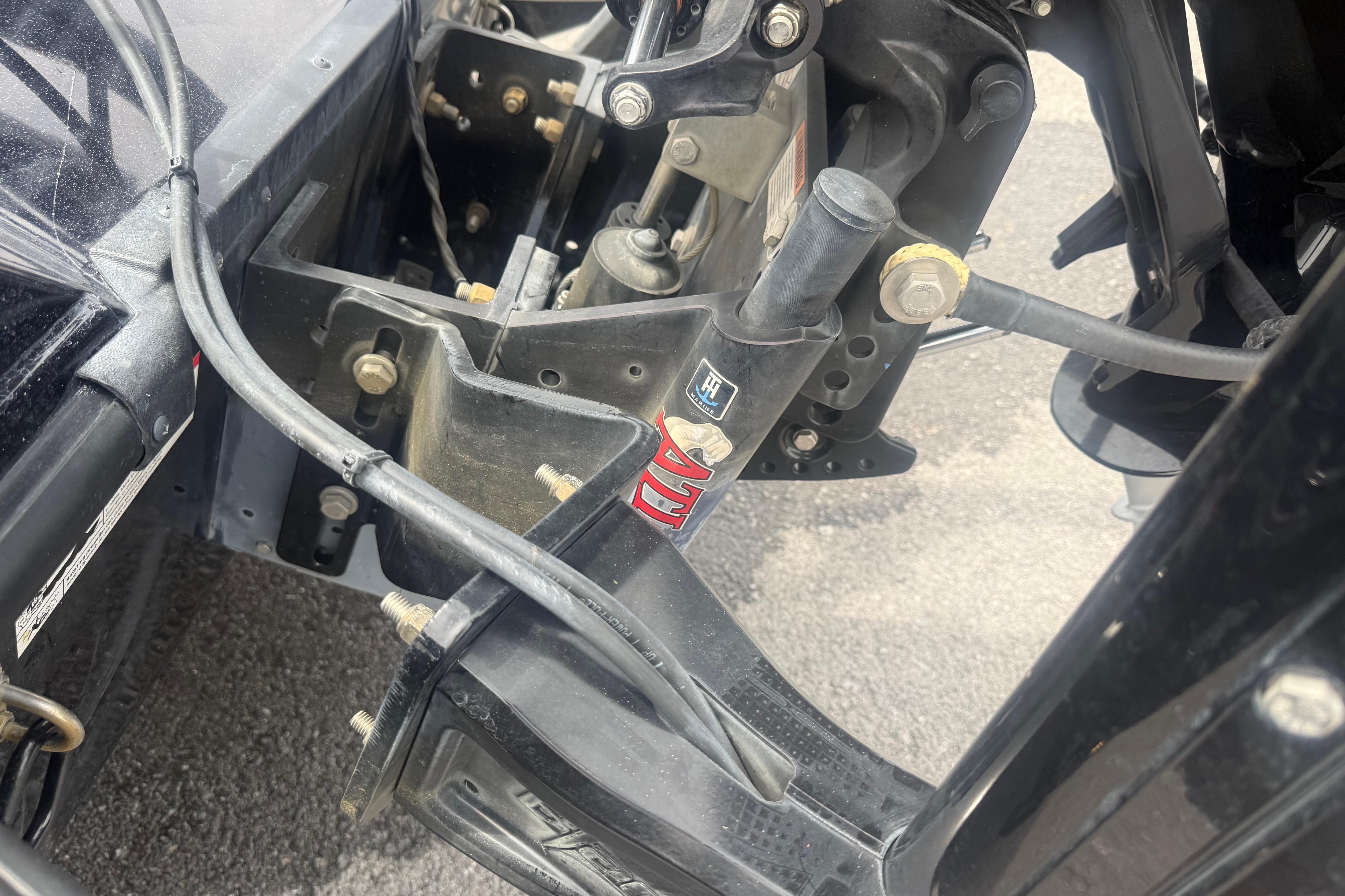 Close-up of 2024 Triton 20XP boat engine mount and hydraulic system.
