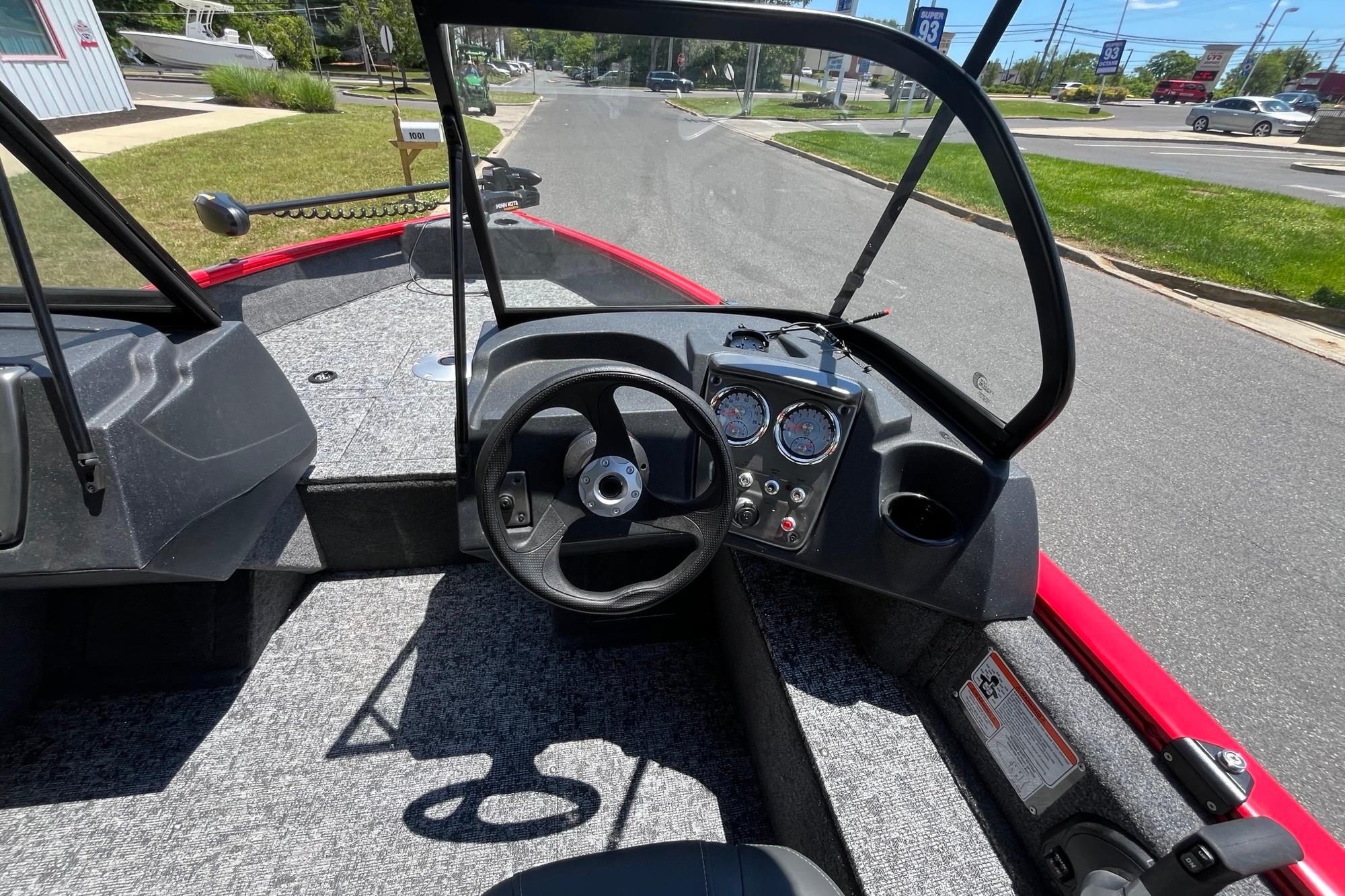 2026 Tracker Pro Guide V-16 WT boat interior with steering wheel and dashboard controls.