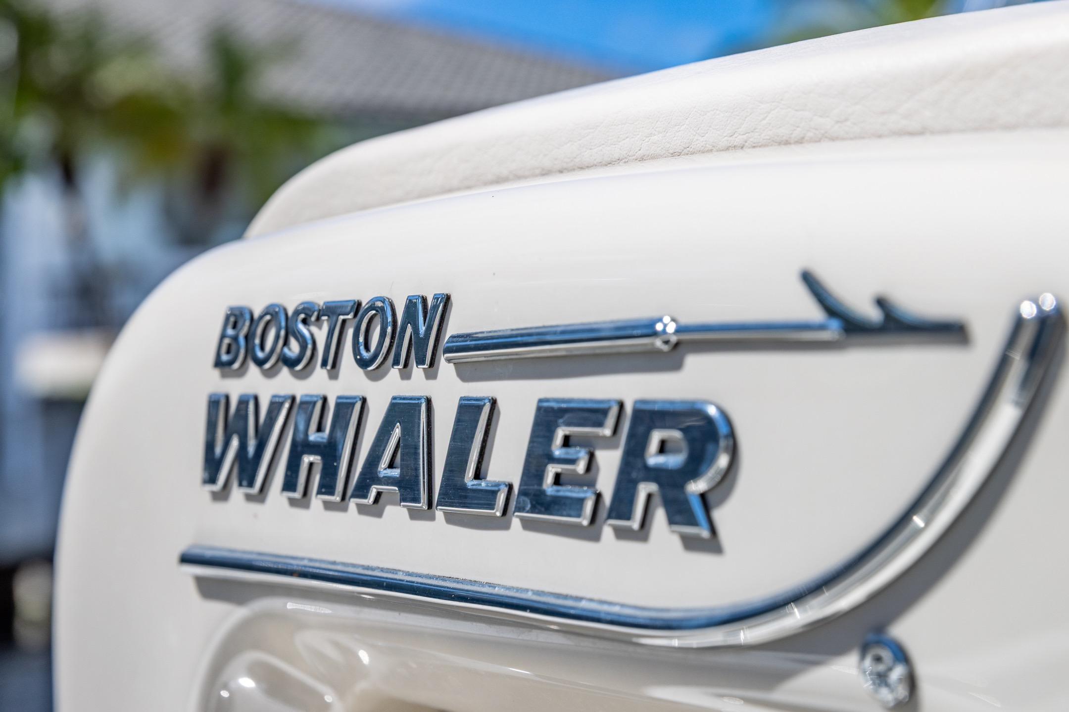 Close-up of 2016 Boston Whaler 280 Outrage logo on boat exterior.