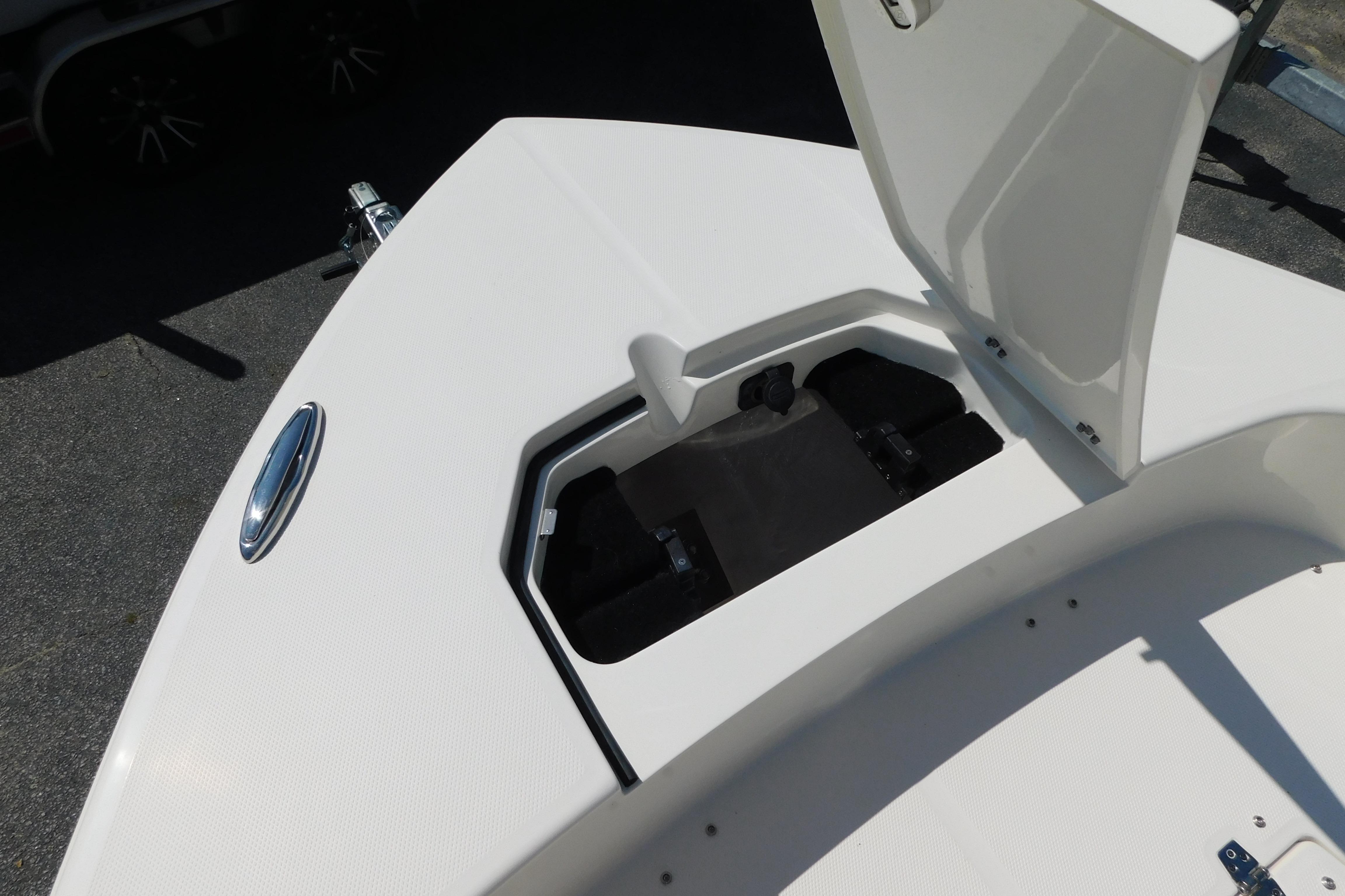 Open storage compartment on 2026 Pathfinder 2400 TRS boat deck.