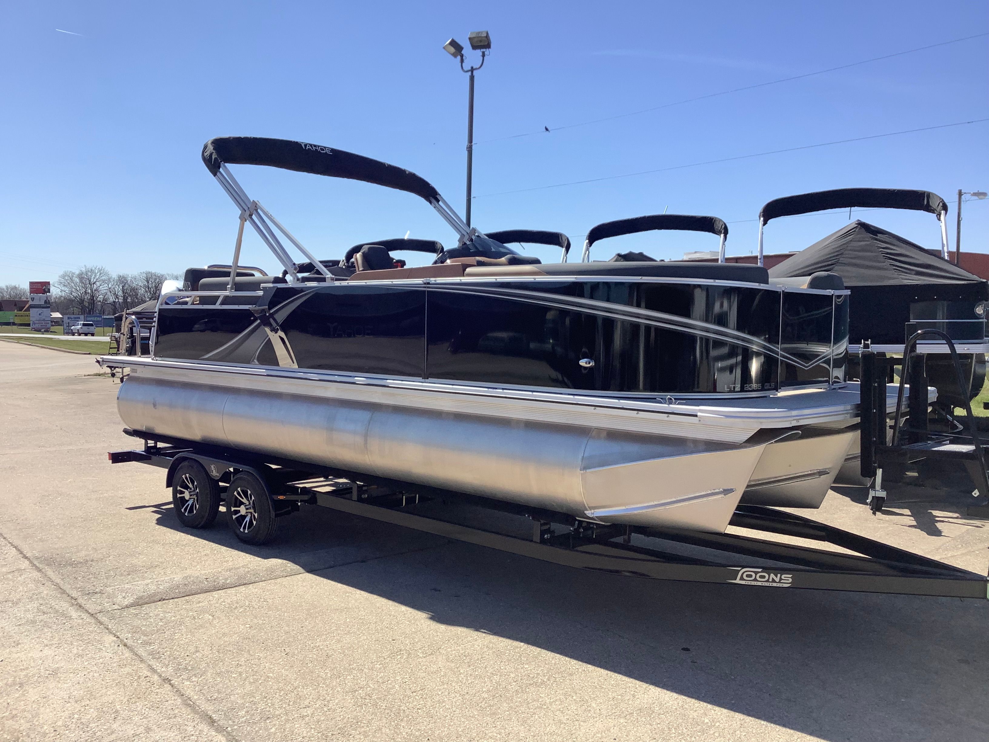 2026 Tahoe 2385 LTZ Quad Lounger on trailer, sunny day.