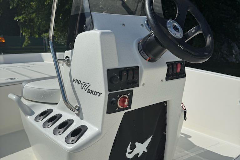 2026 Mako Pro Skiff 17 CC boat console with steering wheel and control panel.