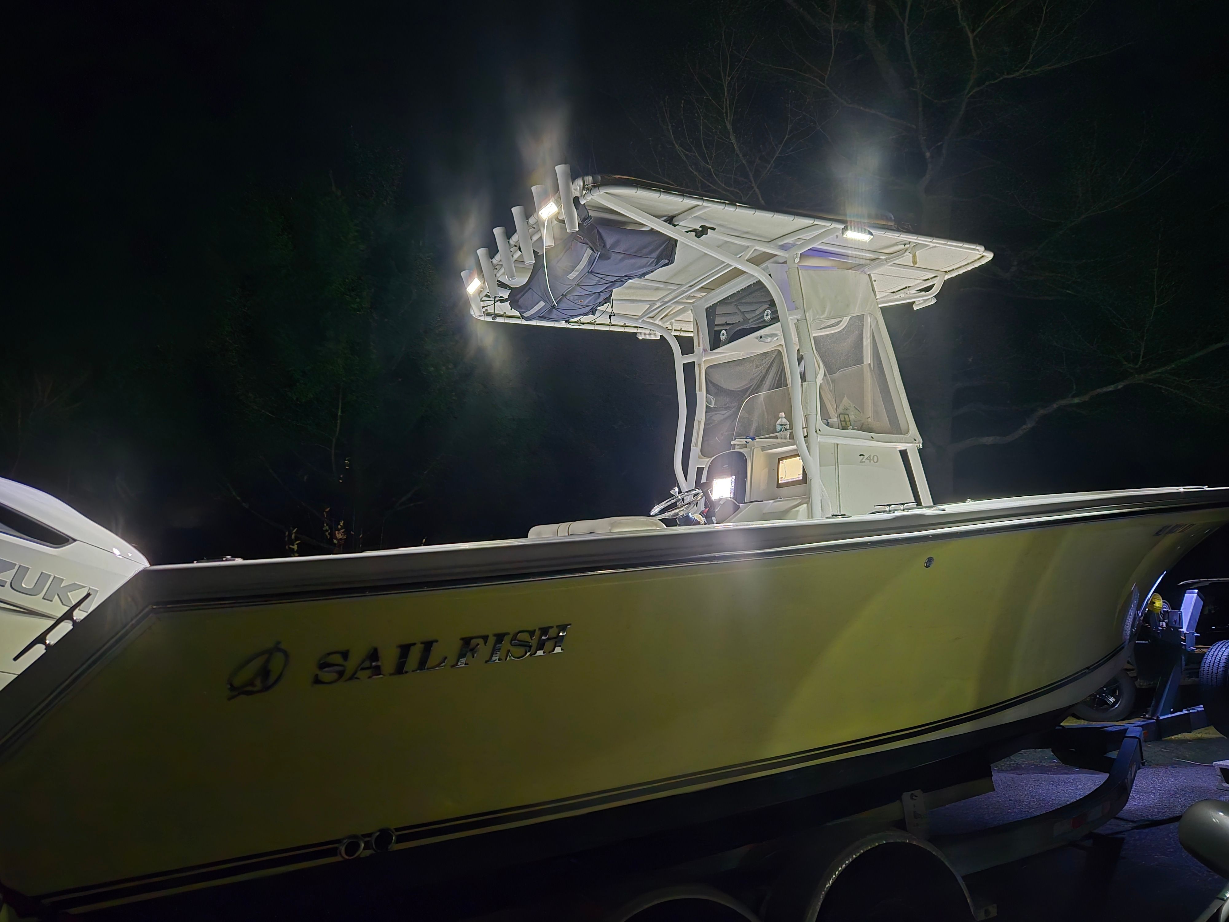 Night view of a 2002 Sailfish 236 CC boat with lighting.