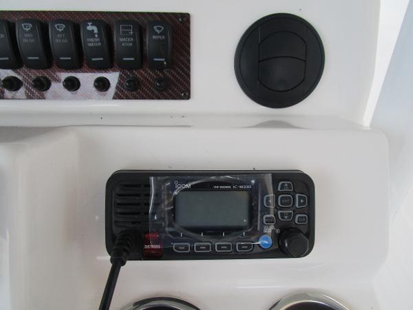 Control panel of 2025 Solara S-250 CW boat with radio and switches.