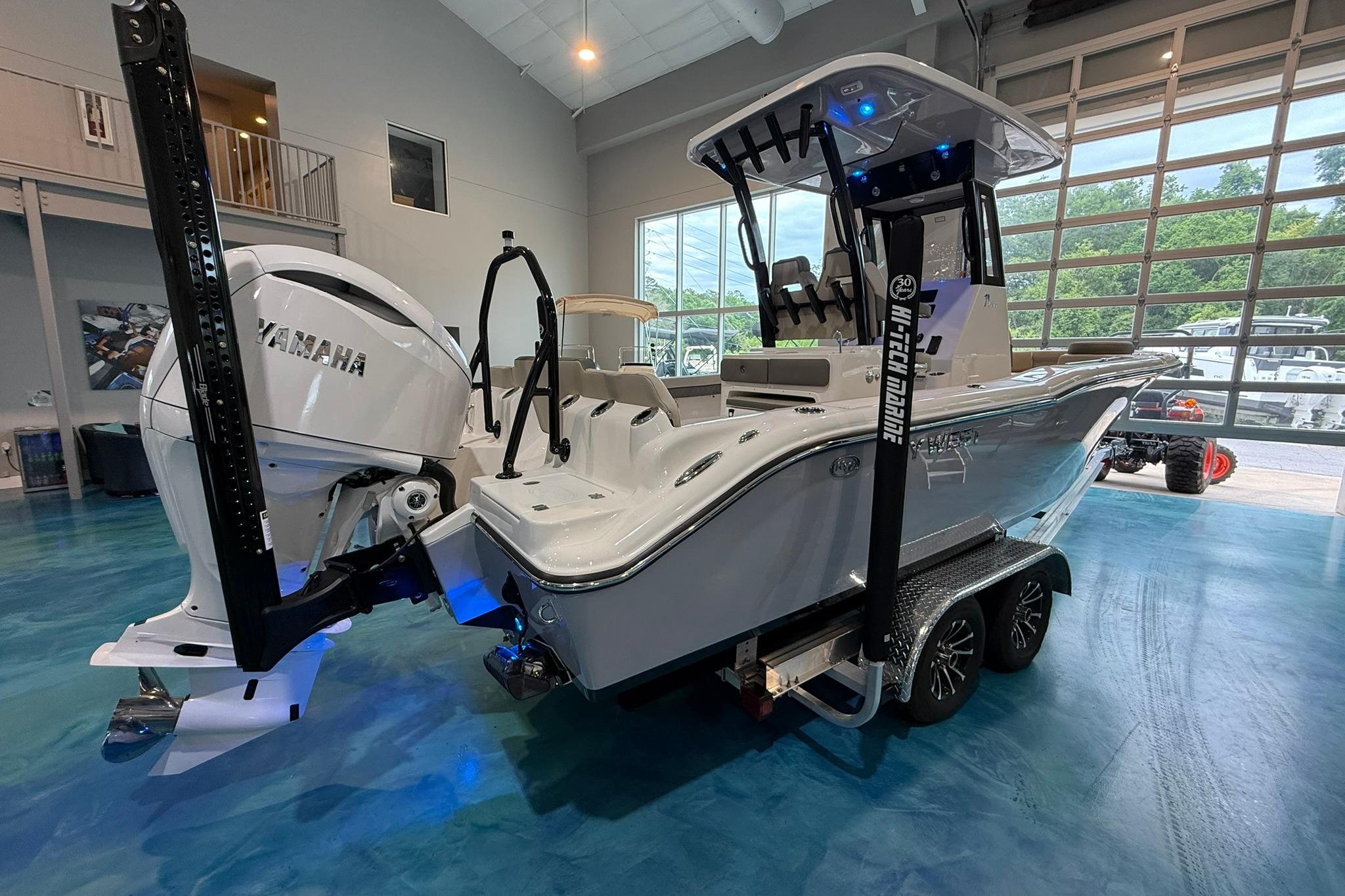 2026 Key West 249 FS boat with Yamaha engine in showroom setting.