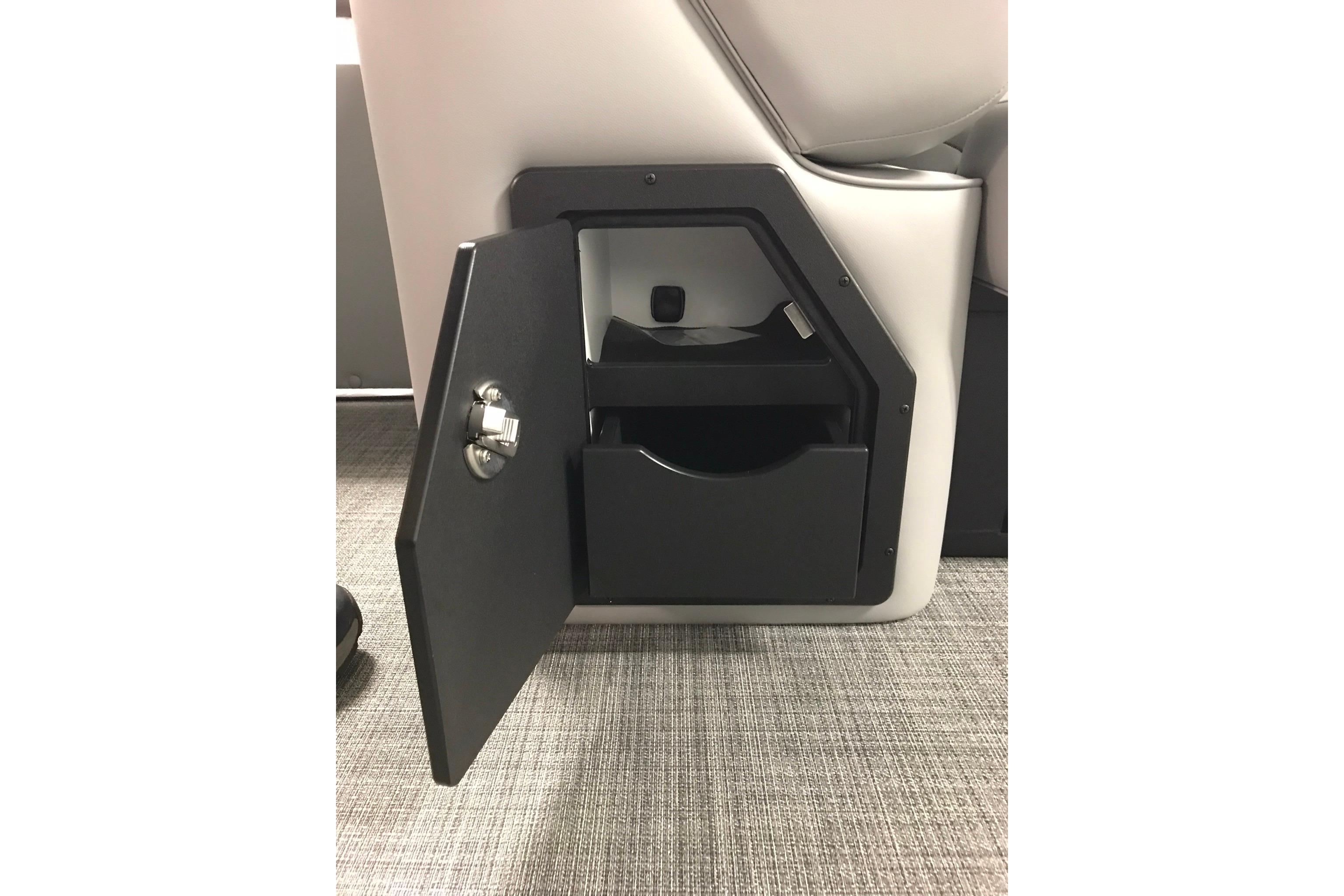 2026 JC NEPTOON SPORT 21TT storage compartment with open door on carpeted floor.