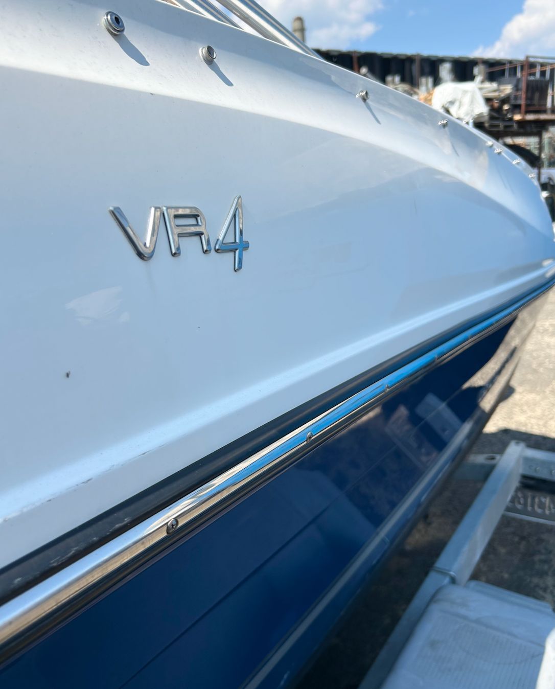 Close-up of the blue and white hull of a 2019 Bayliner VR4 Bowrider OB.
