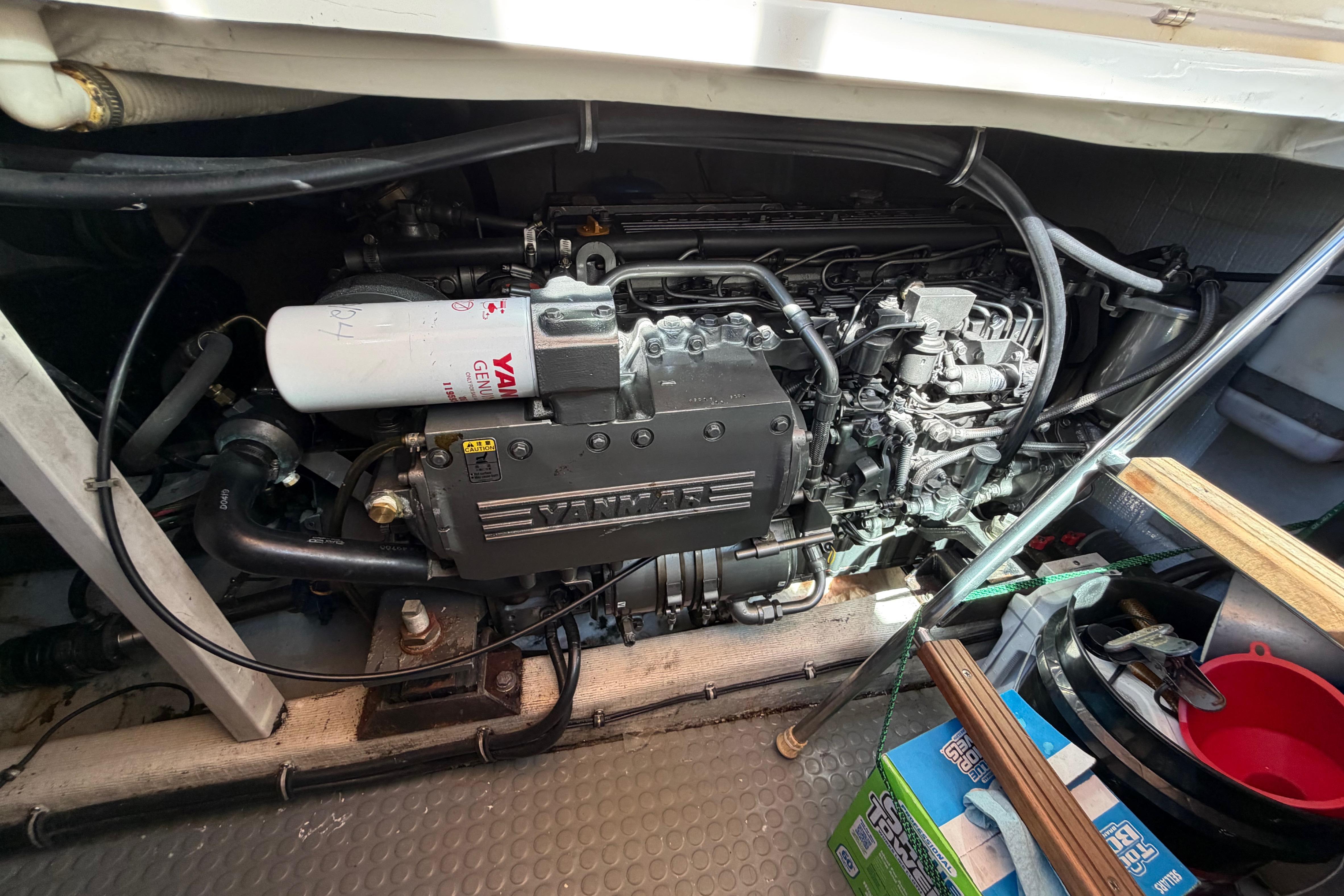 Engine compartment of a 2000 Sabreline 36 Express boat, featuring a Yanmar engine.