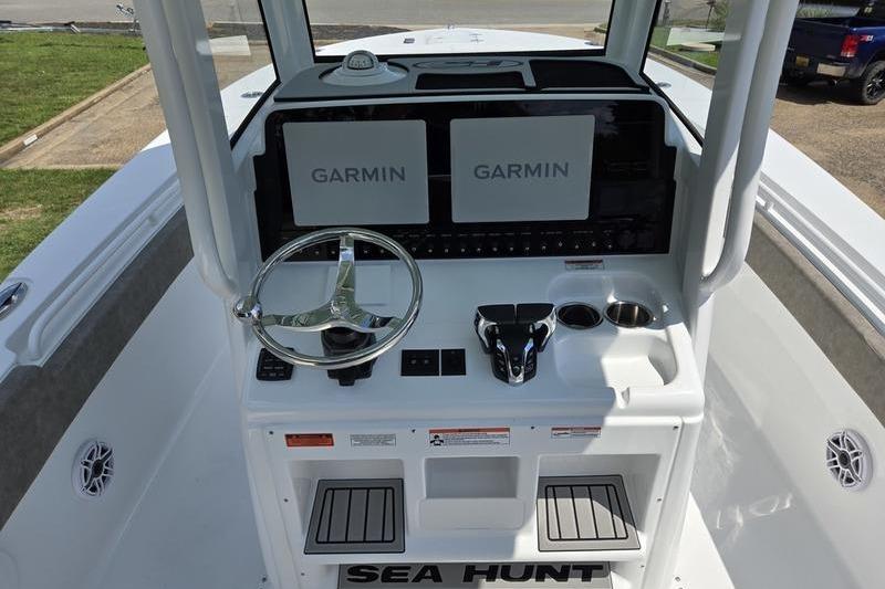 2027 Sea Hunt Ultra 275 SE boat dashboard with dual Garmin displays and steering wheel.