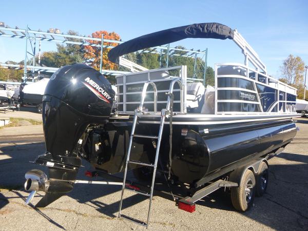2024 Ranger Reata 223C pontoon boat with Mercury outboard engine, parked on a trailer.