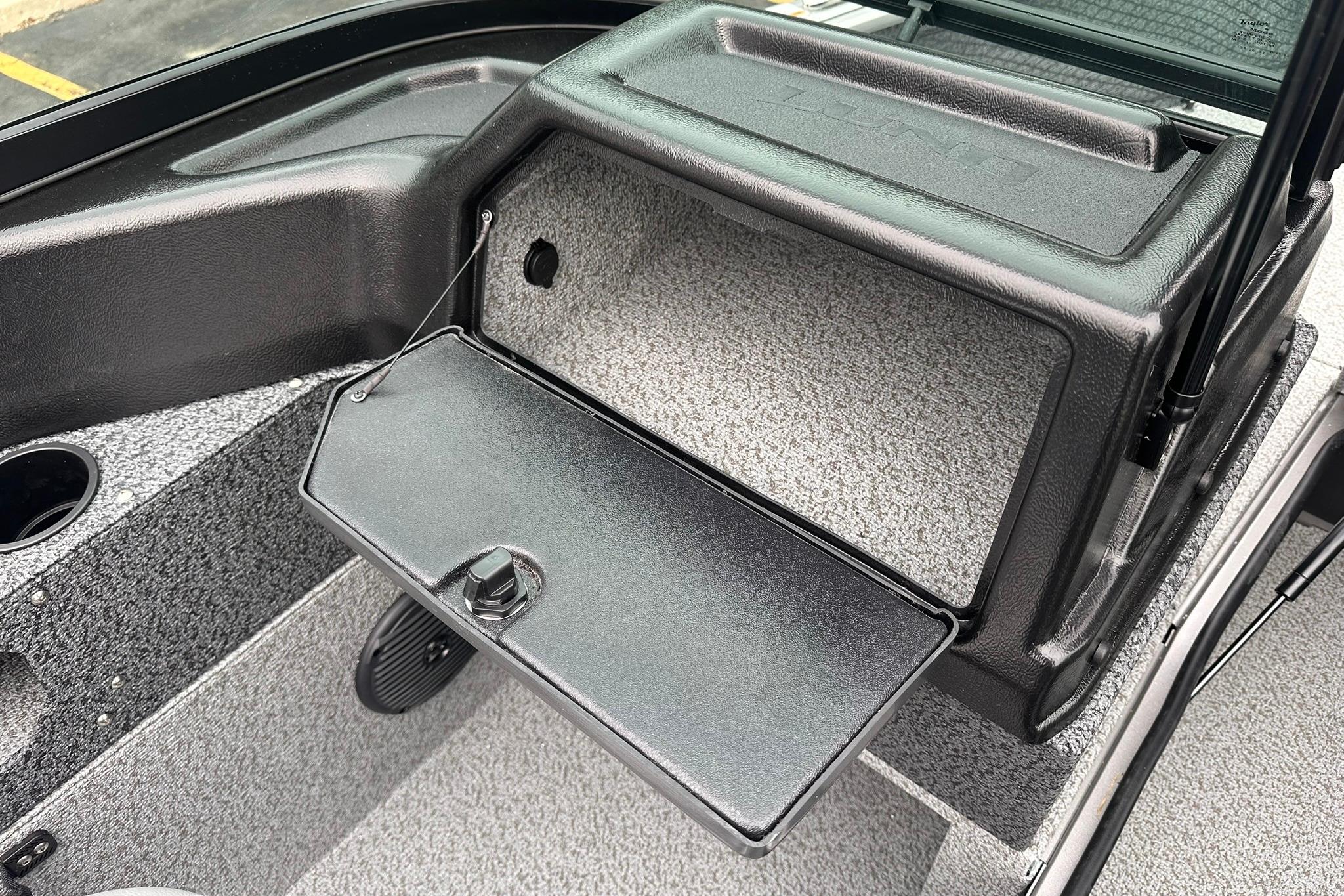 2026 Lund 1775 Impact XS Sport boat interior with open storage compartment.