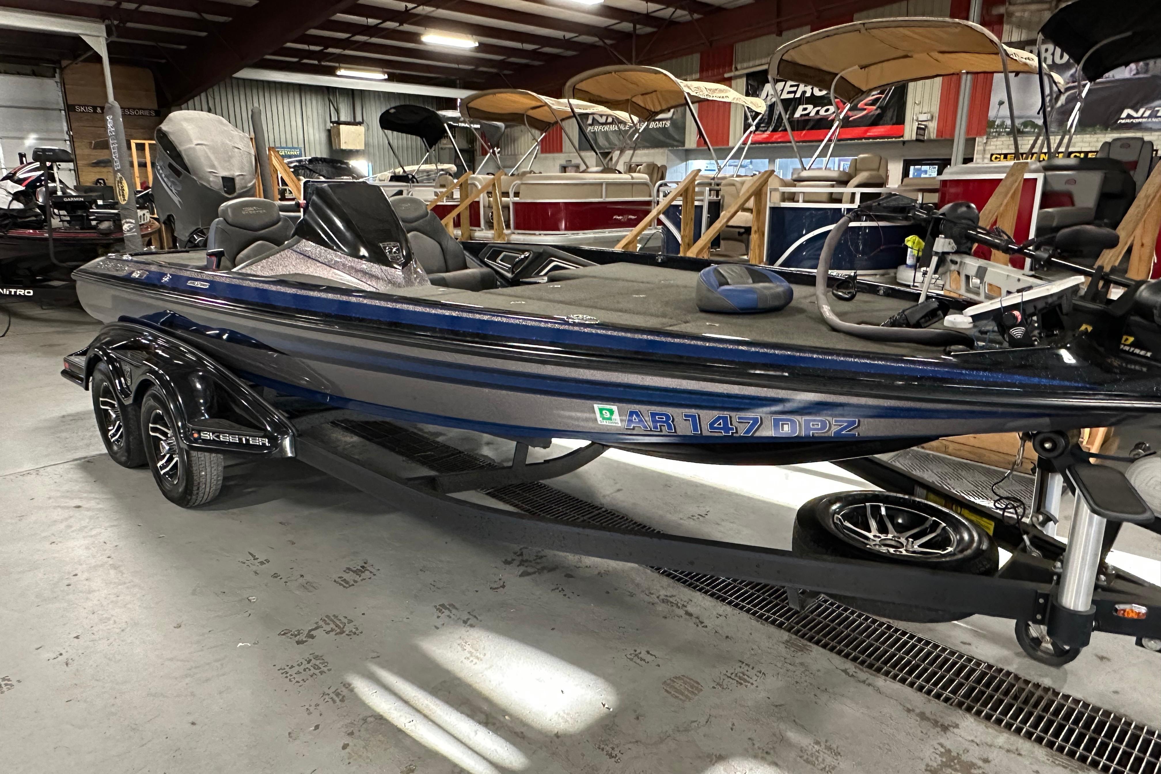 2016 Skeeter FX20 Limited Edition bass boat in showroom, side view.