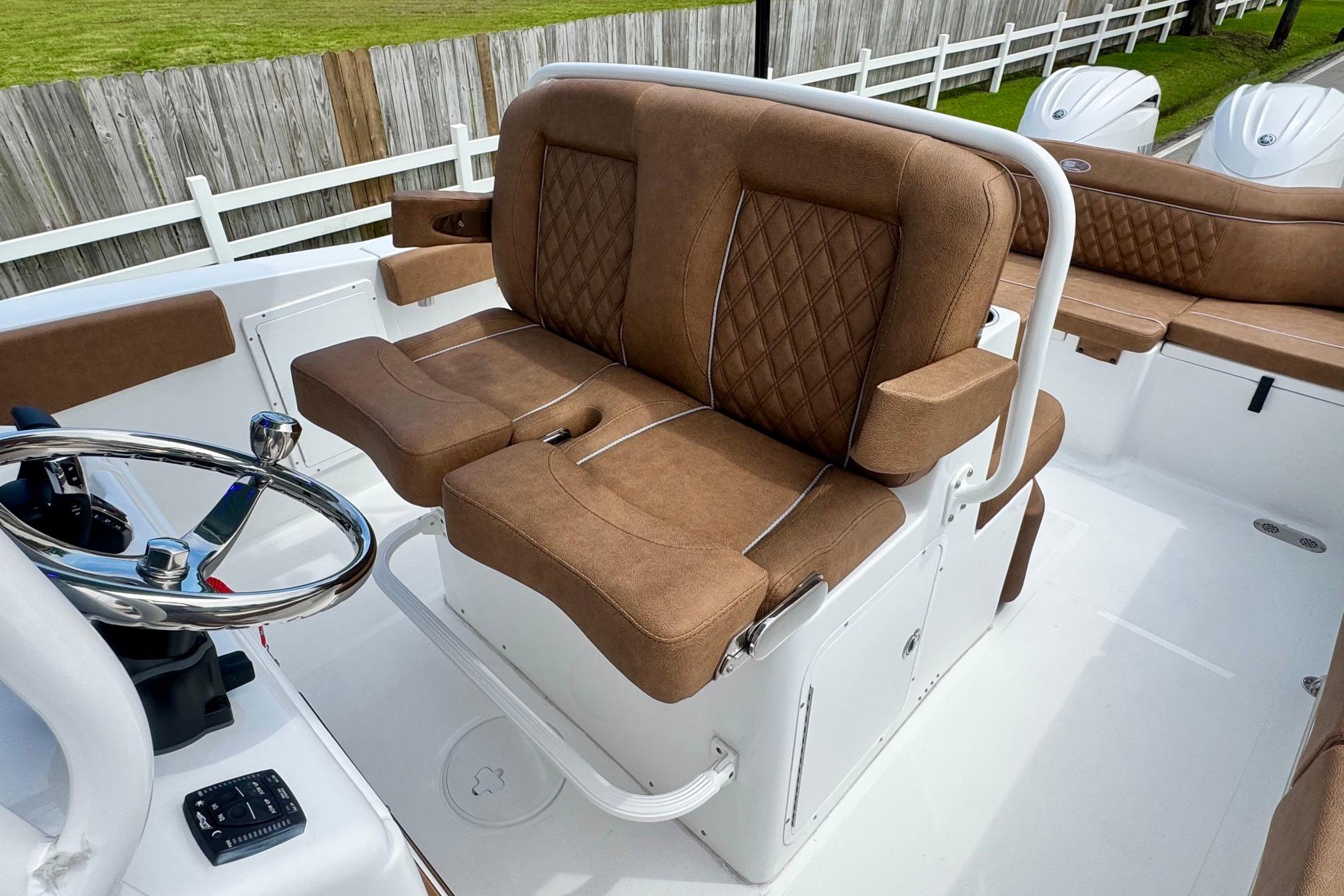 Luxurious brown seating on 2026 Sea Hunt Ultra 275 SE boat interior.