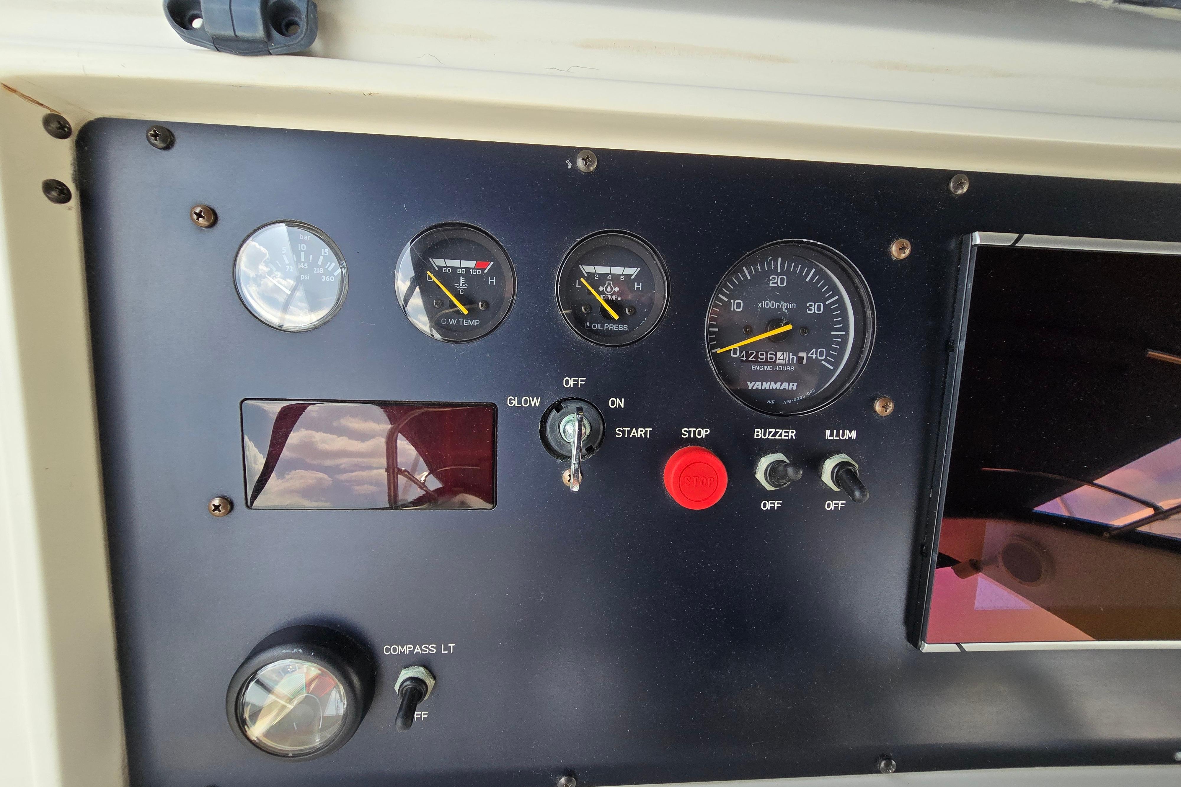 Control panel of a 2004 Grand Harbour 58 yacht with gauges and switches.