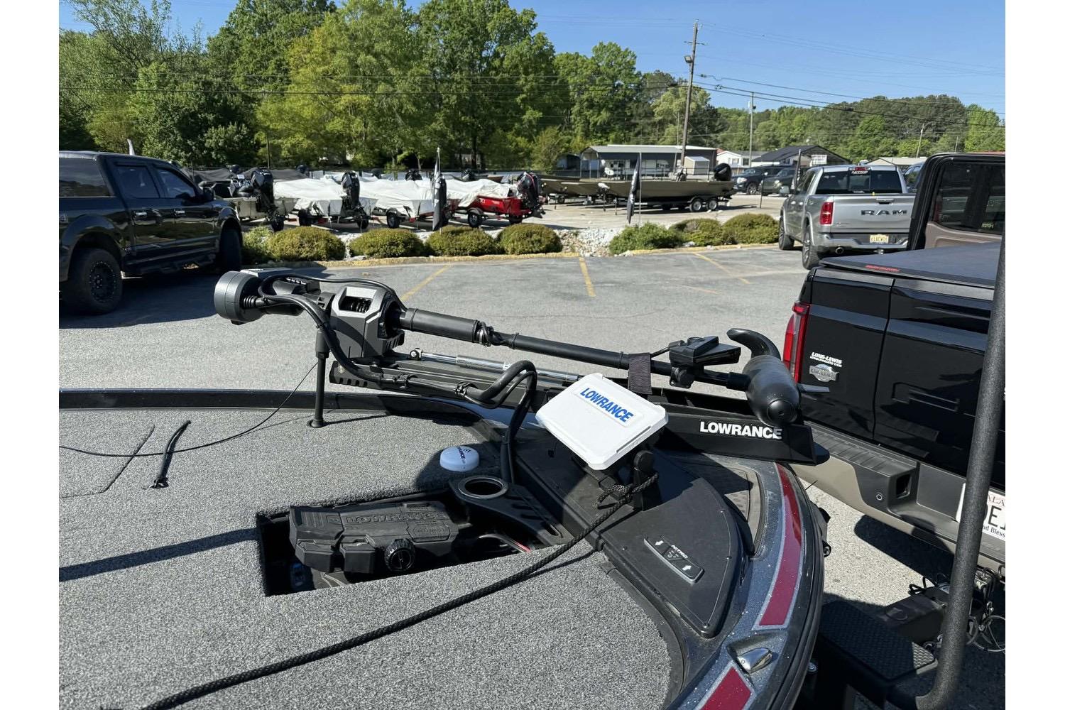 Nitro Z20 Pro 2023 boat with Lowrance equipment in a parking lot.