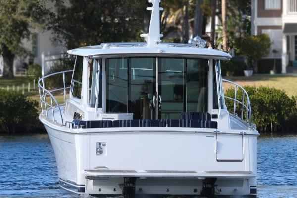 2025 Sabre 43 Salon Express yacht on a serene waterway.