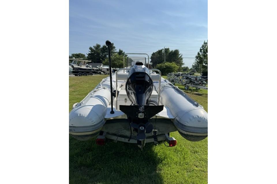 2022 North Atlantic Inflatables RIB420H boat with outboard motor on grassy field.