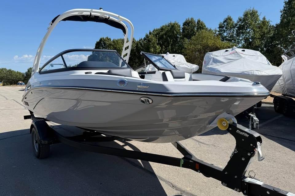 2026 Yamaha Boats 195S on trailer, sleek design, parked outdoors.