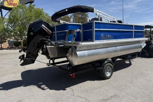 2026 Sun Tracker Party Barge 18 DLX pontoon boat with Mercury outboard motor on trailer.
