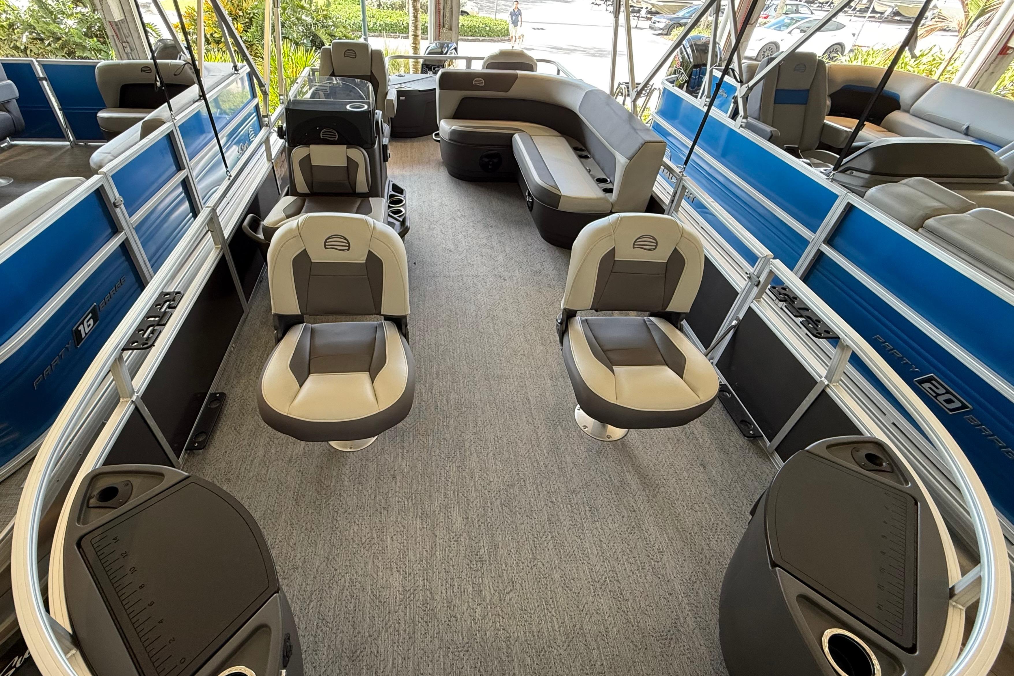 2026 Sun Tracker Bass Buggy 18 DLX pontoon boat interior with seating and storage.