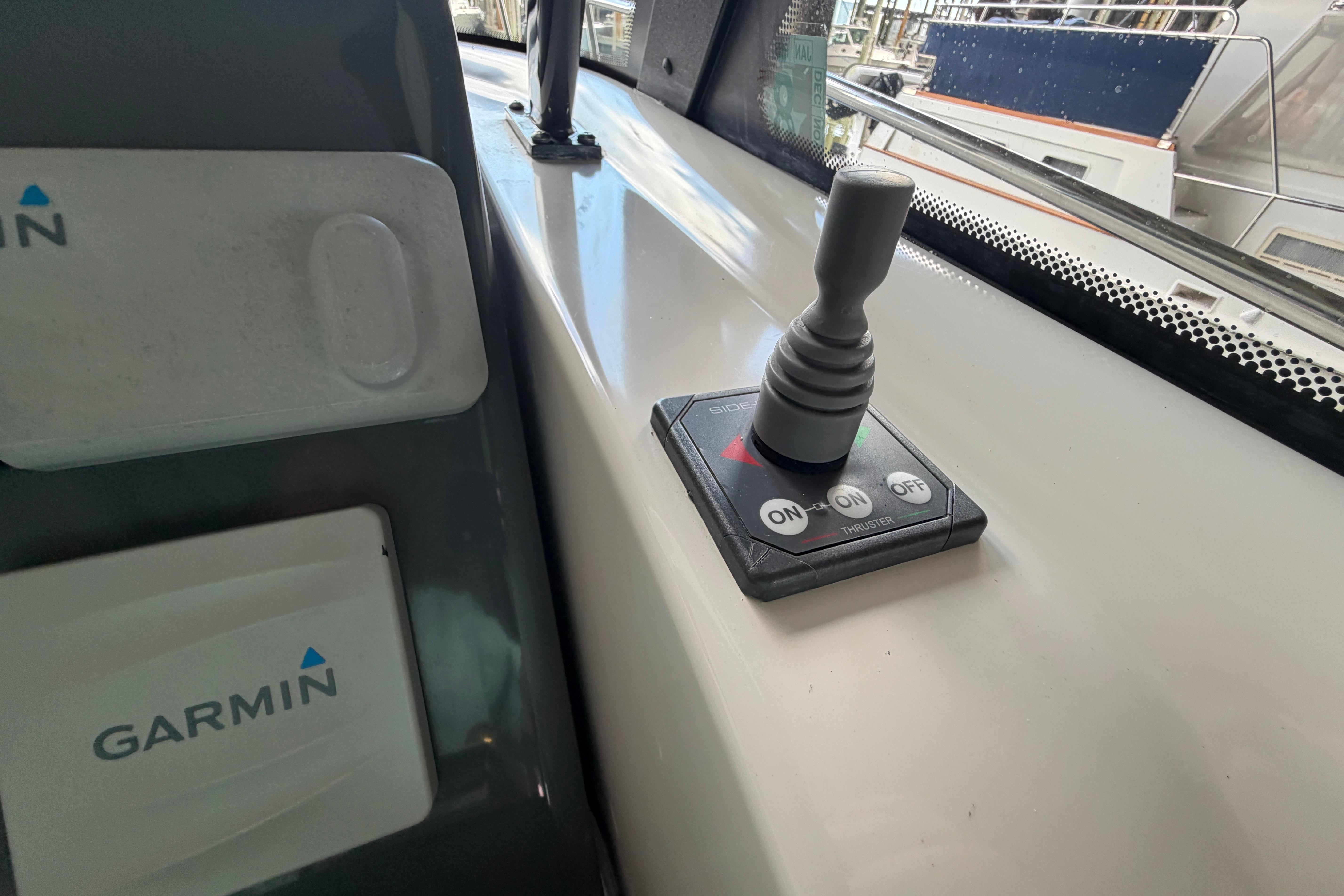 Control panel with joystick and Garmin device on 2002 Tiara Yachts 3800 Open.