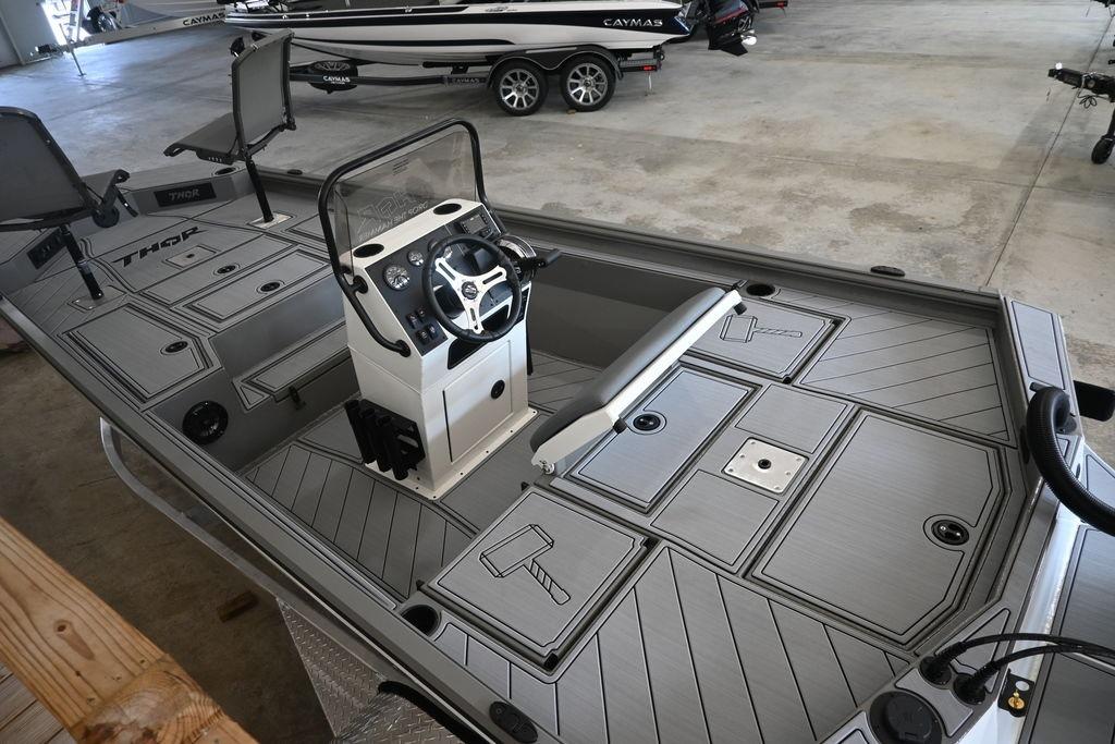 2026 Thor Lake Hammer 1900CC boat interior with steering console and storage compartments.