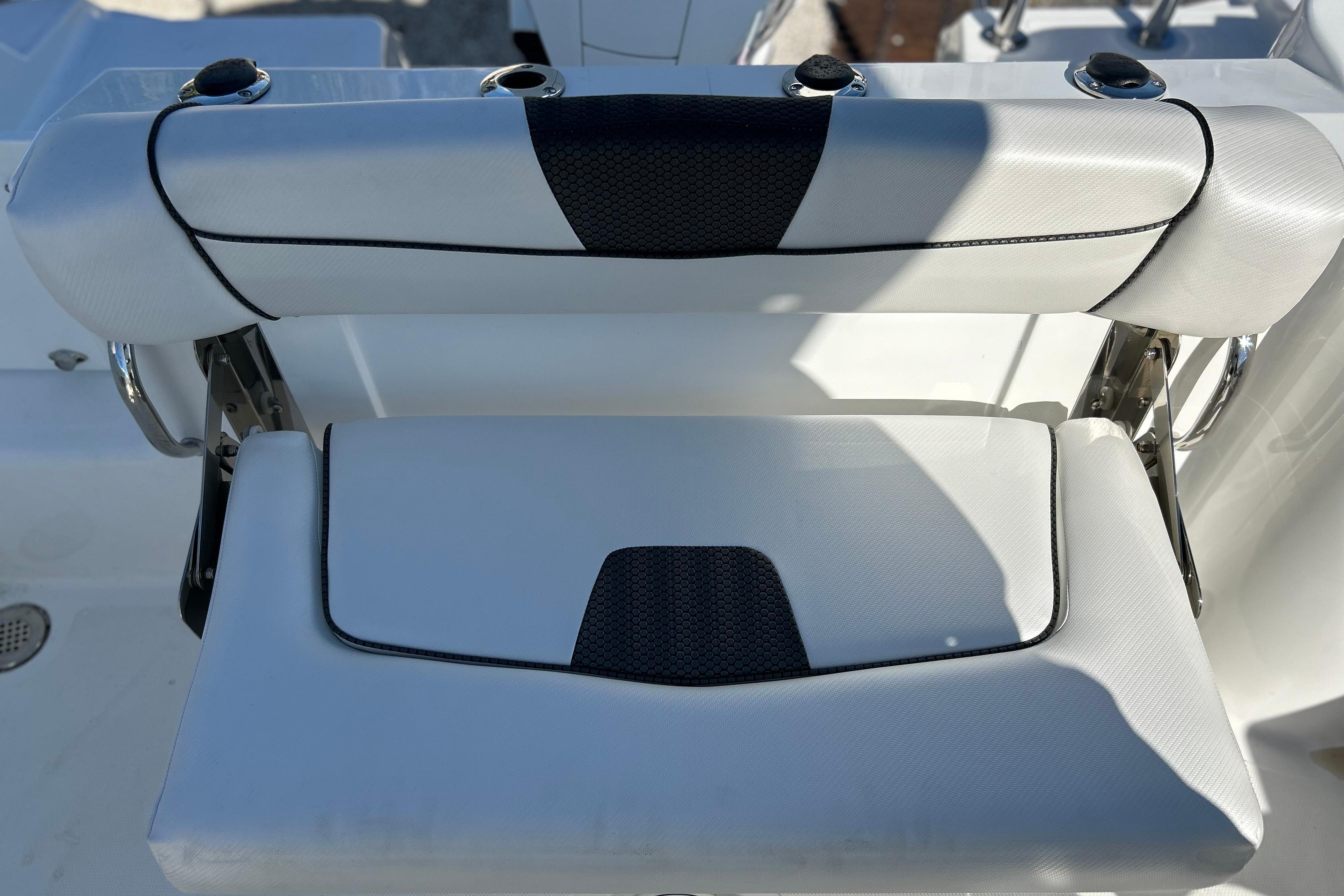 2023 Wellcraft 222 Scarab Offshore boat seat with black and white upholstery.