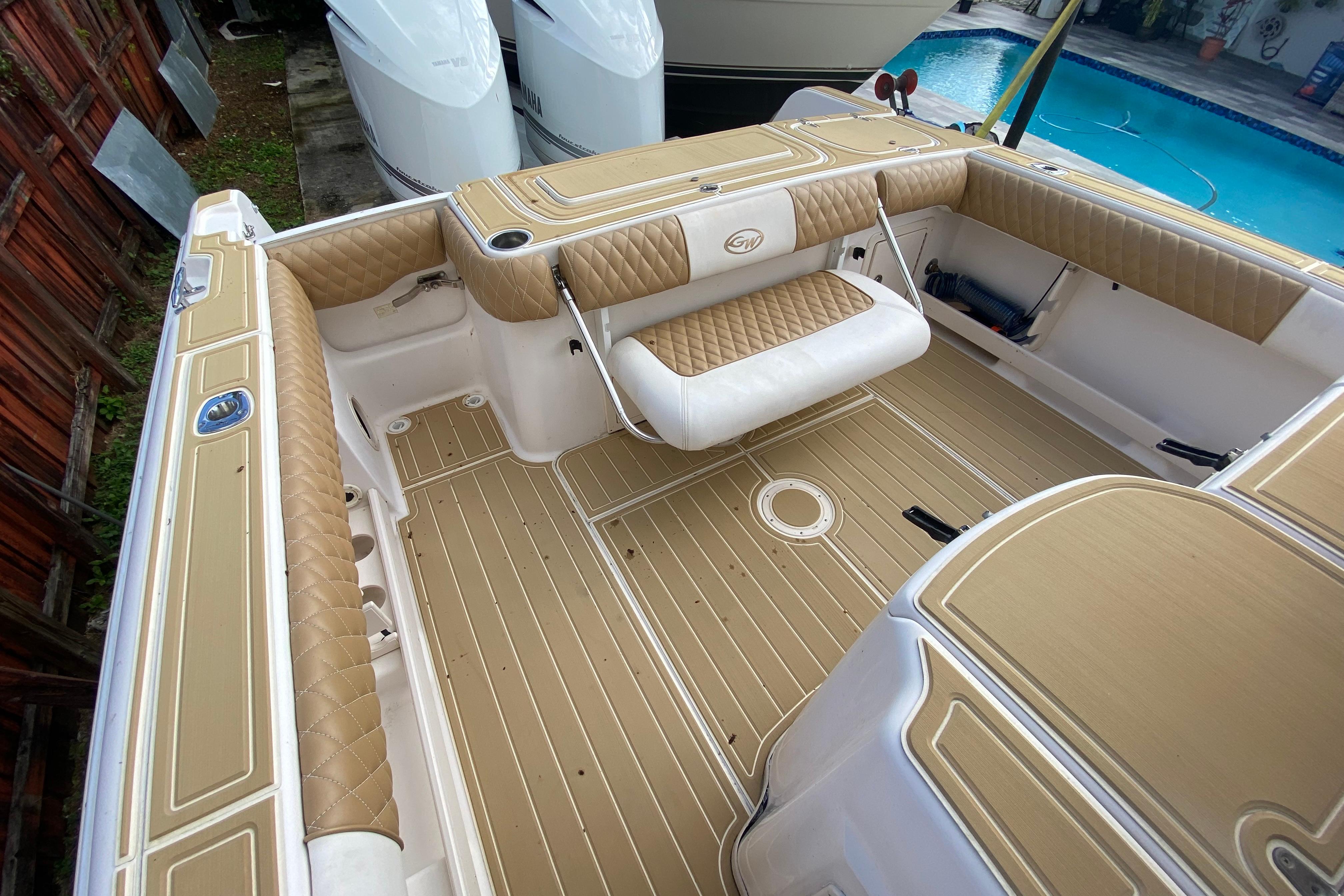 2004 Grady-White Canyon 283 boat interior with tan upholstery and spacious deck.