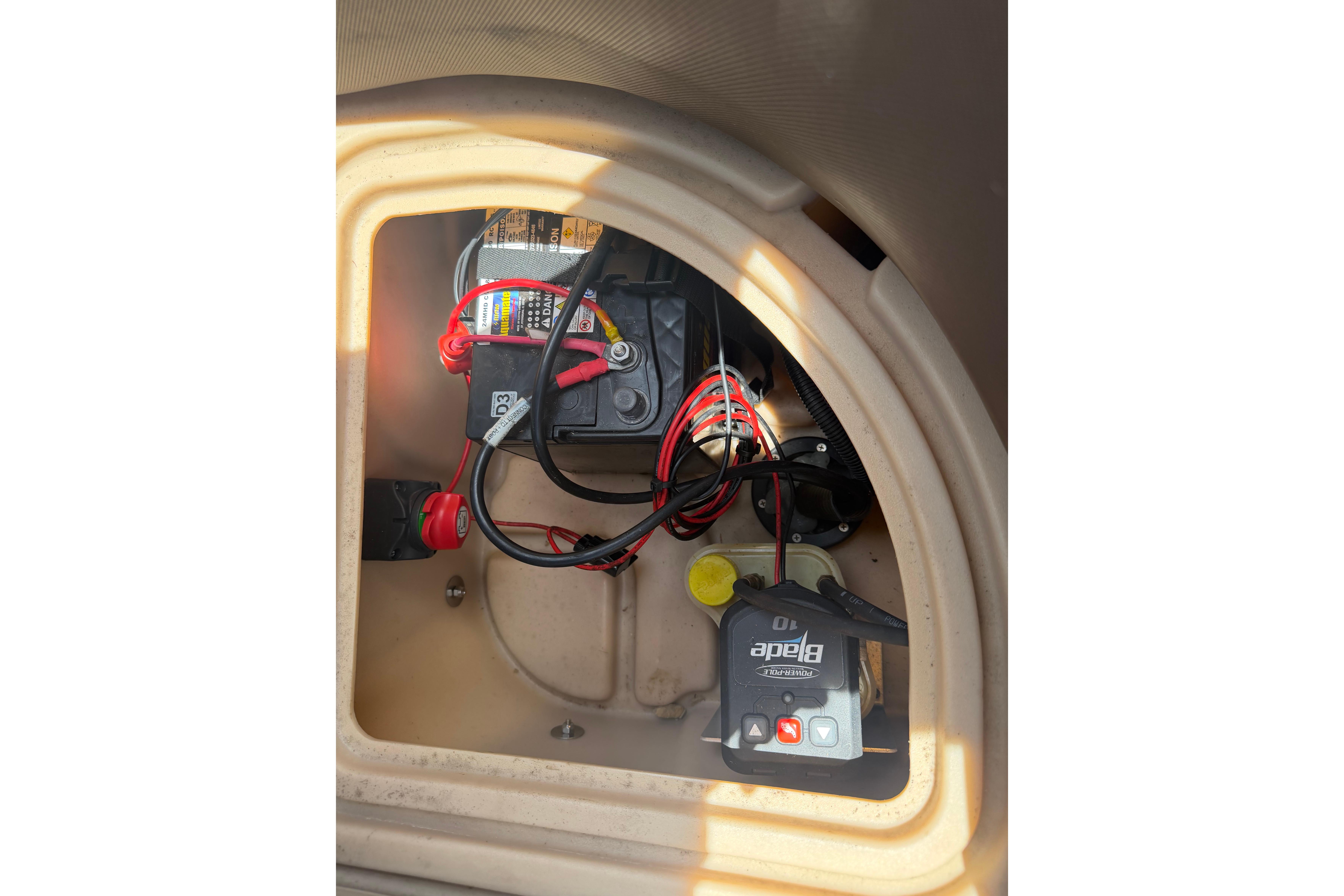 2019 Sun Tracker Party Barge 20 DLX battery compartment with wiring and components.