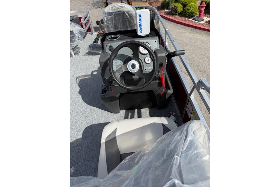2026 Sun Tracker Bass Buggy 18 DLX boat dashboard with steering wheel and controls.