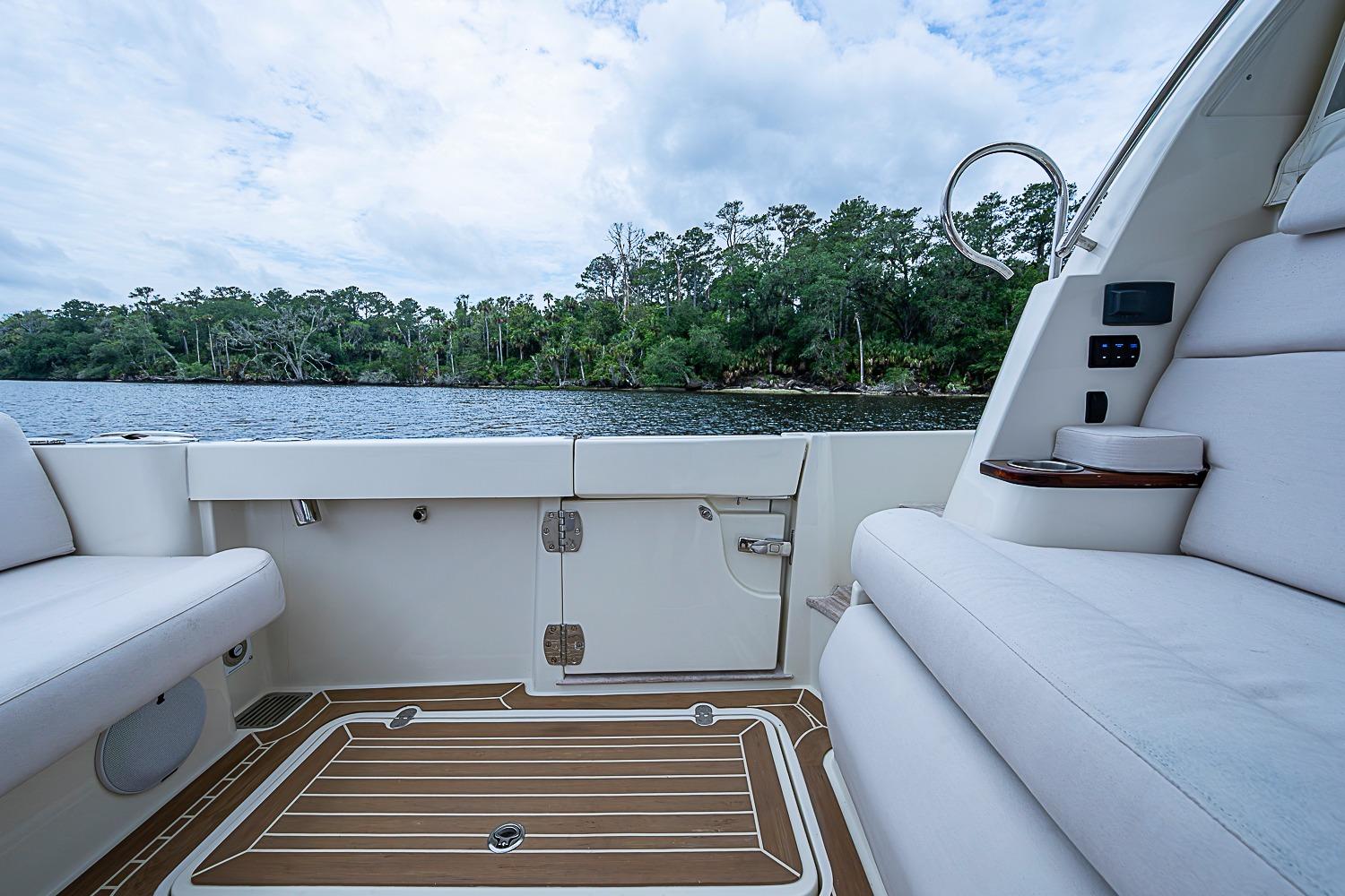 2023 Hinckley Sport Boat 40 X interior with scenic river view.