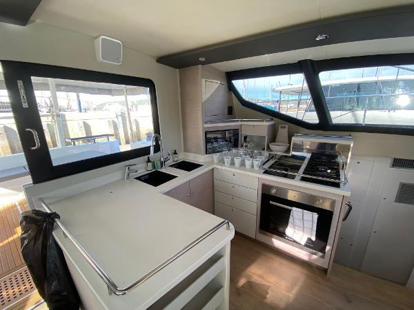 Modern kitchen interior on Vision 444 yacht, 2025 model, featuring sleek appliances and ample counter space.
