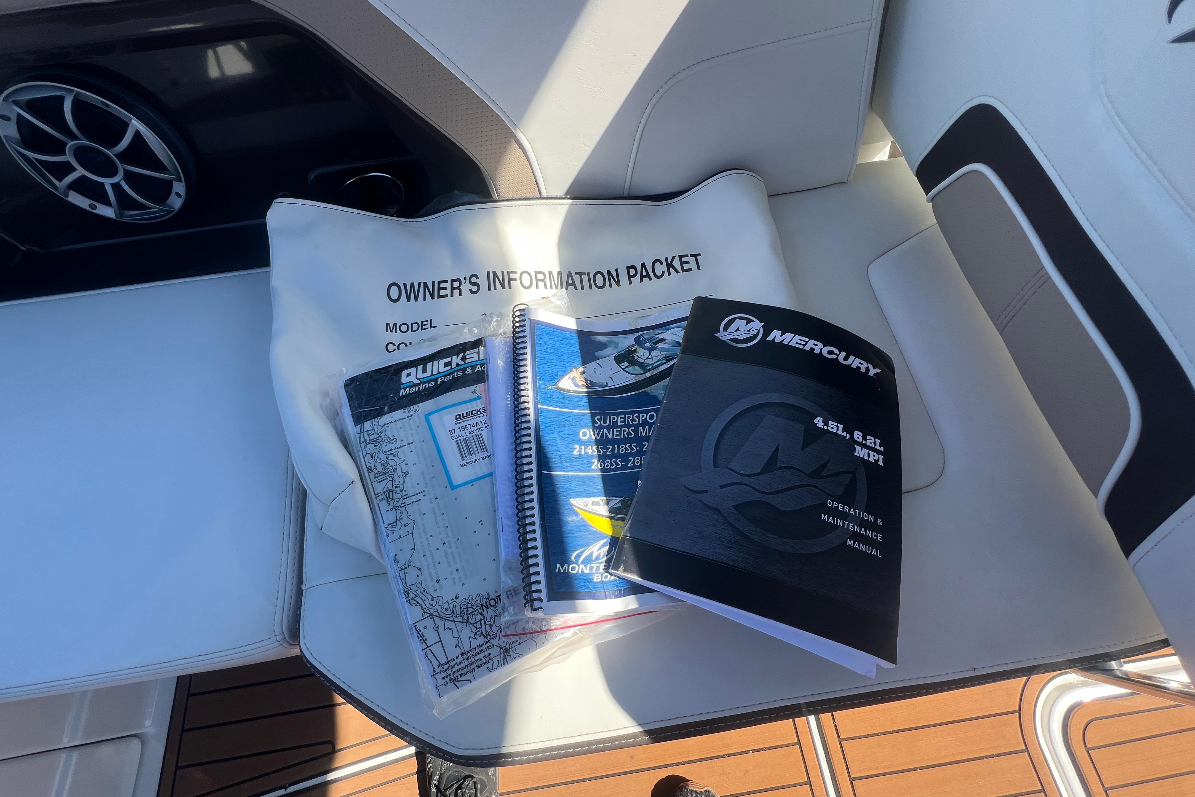 Owner's manuals and information packet for 2017 Monterey 298SS Super Sport on boat seat.