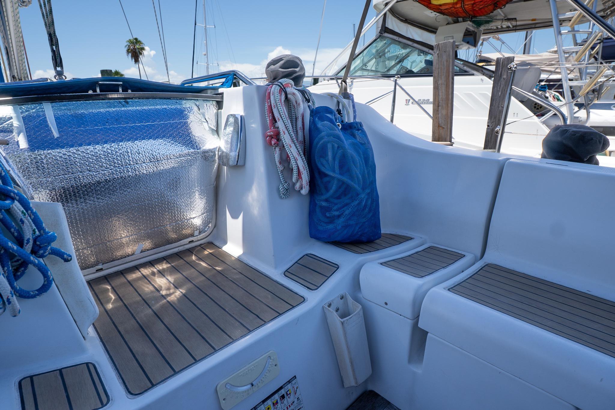 Cockpit of 1993 Beneteau First 38 s5 sailboat with ropes and seating.