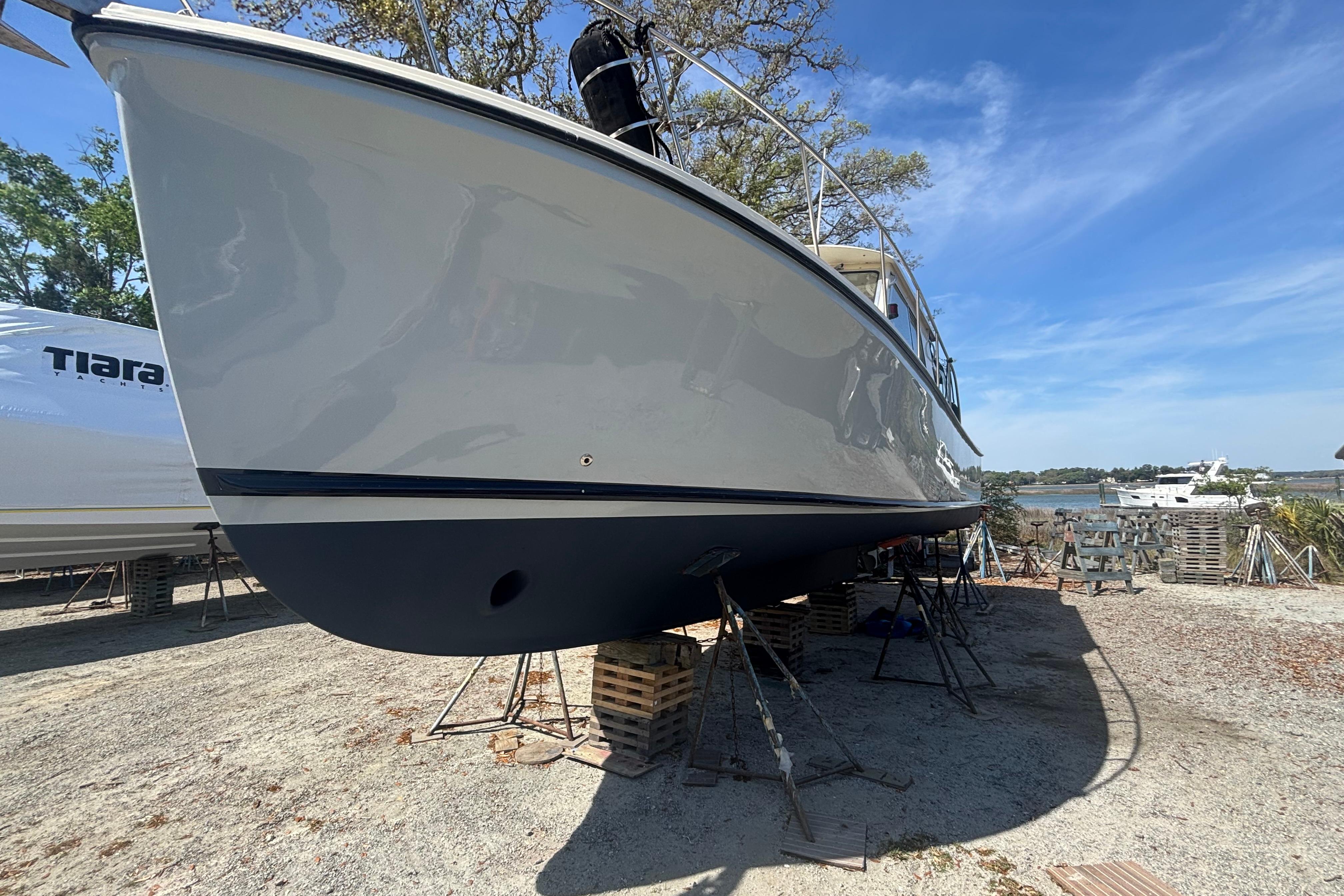 2004 Atlas Boat Works Acadia 32 yacht on stands outdoors.