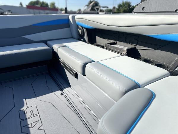 2025 Axis A225 boat interior with gray and blue seating, showcasing modern design and comfort.