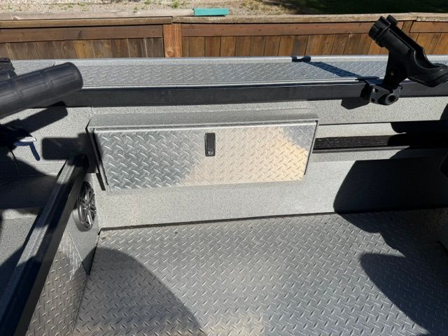 Interior of a 2008 Willie Boats Predator with diamond plate flooring.