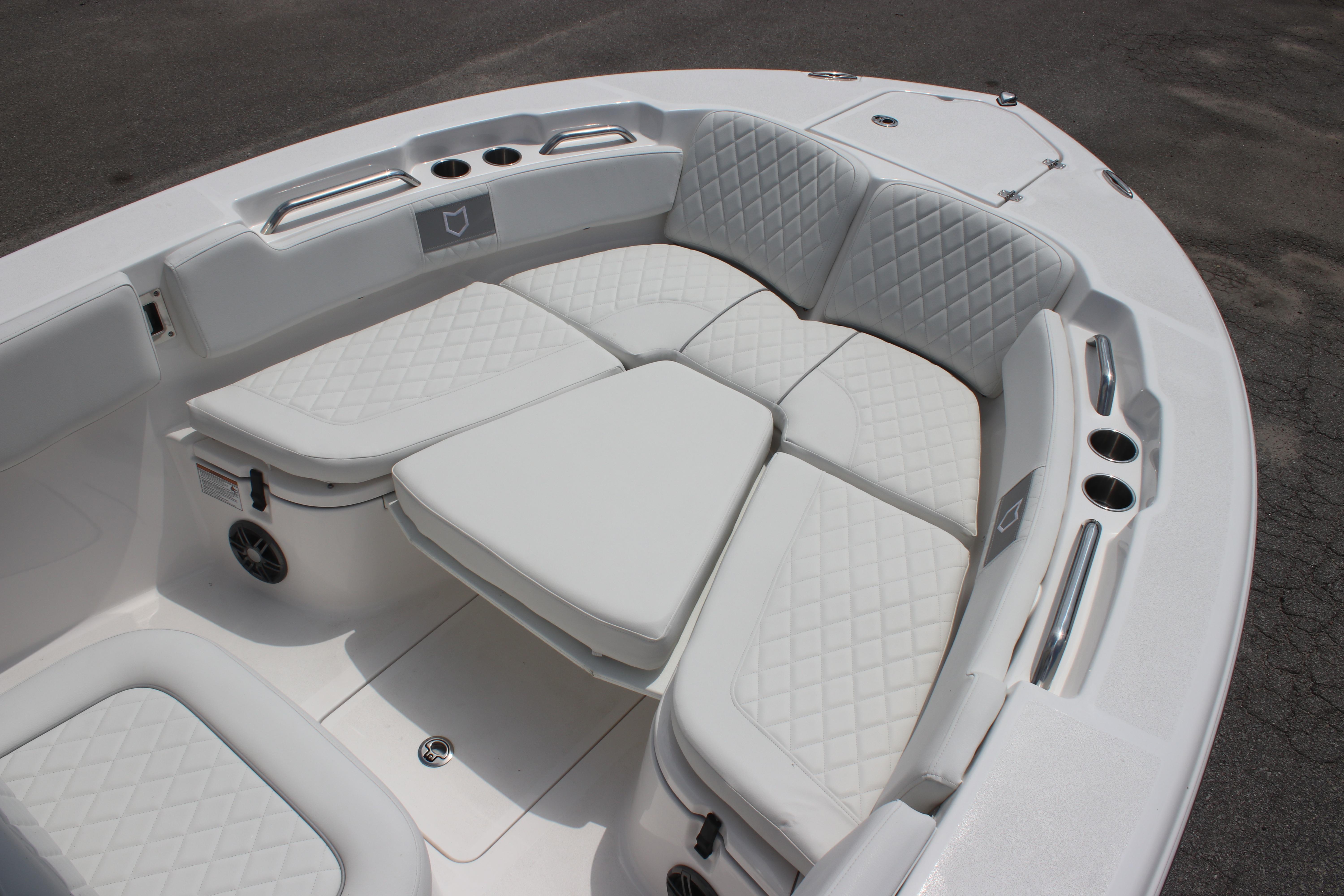 2026 Sea Fox 248 Commander boat with luxurious white seating and cup holders.