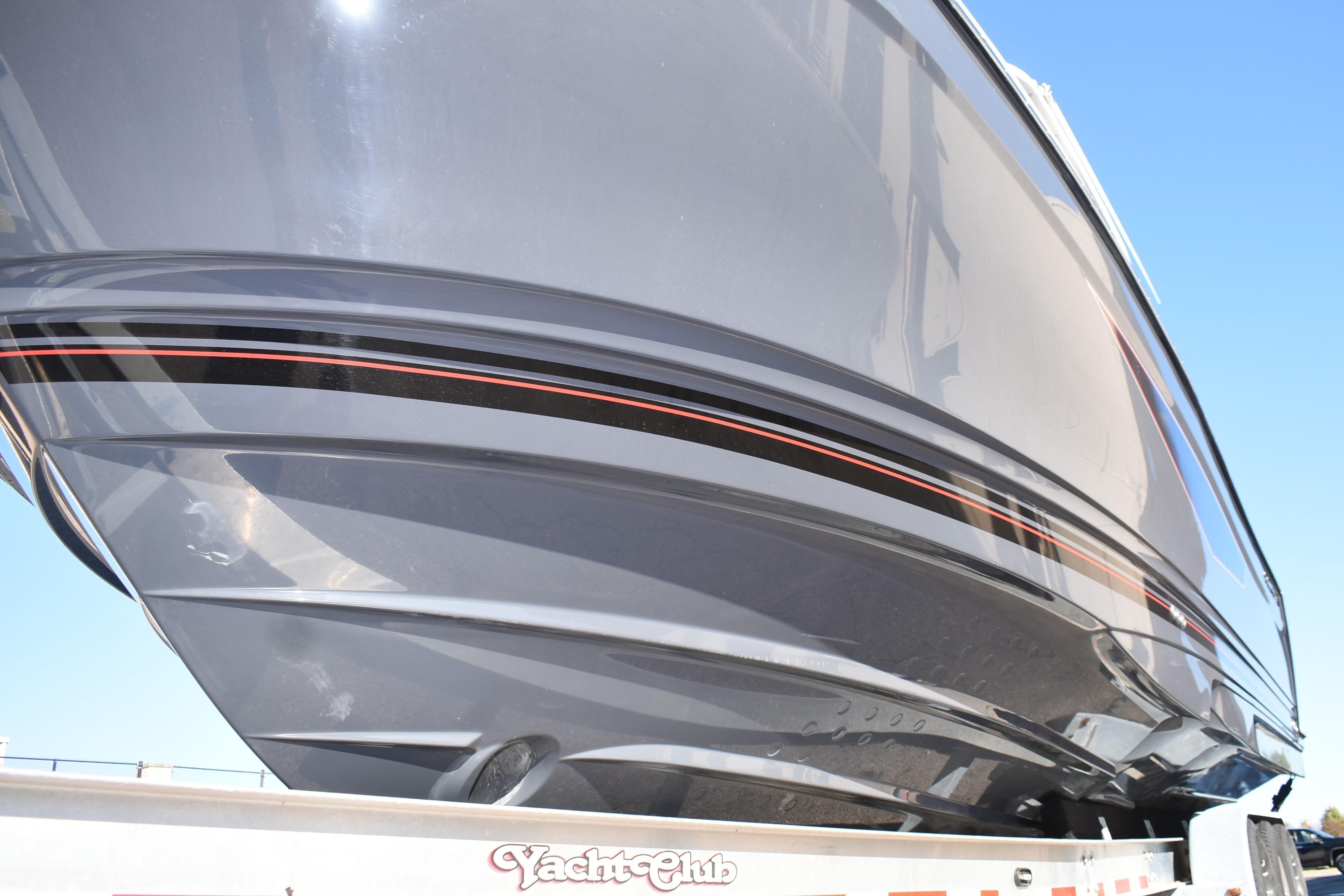 2025 Solara S-310 CW boat hull with sleek design and black-red stripes.