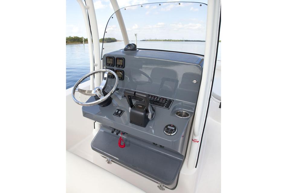 Manufacturer Provided Image: 2013 Pursuit C 260 Center Console boat helm with steering wheel and controls.