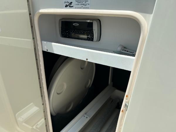 2005 Sea Ray 220 Sundeck storage compartment with stereo system.
