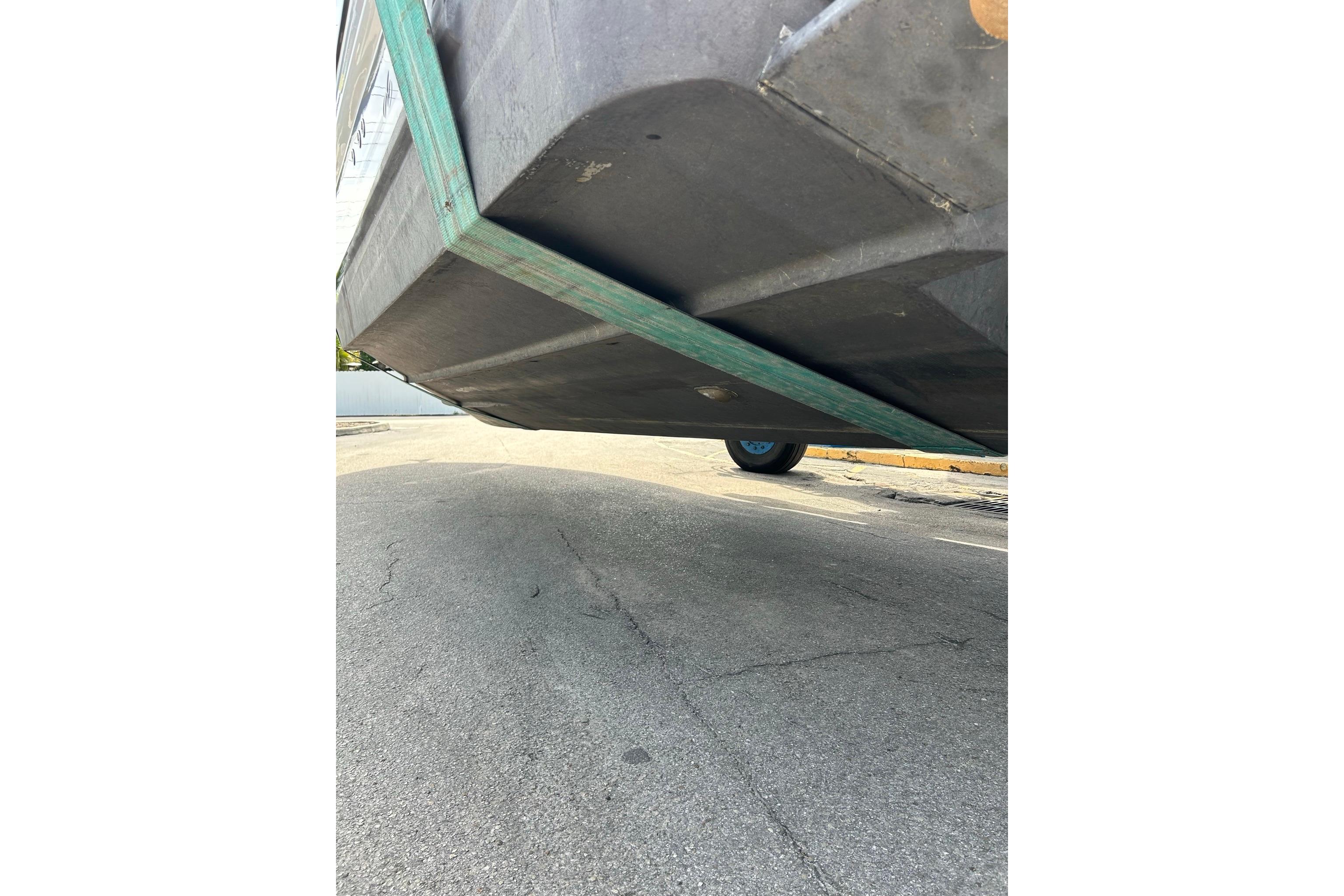 2019 Monterey 335 Sport Yacht hull underside view on pavement.