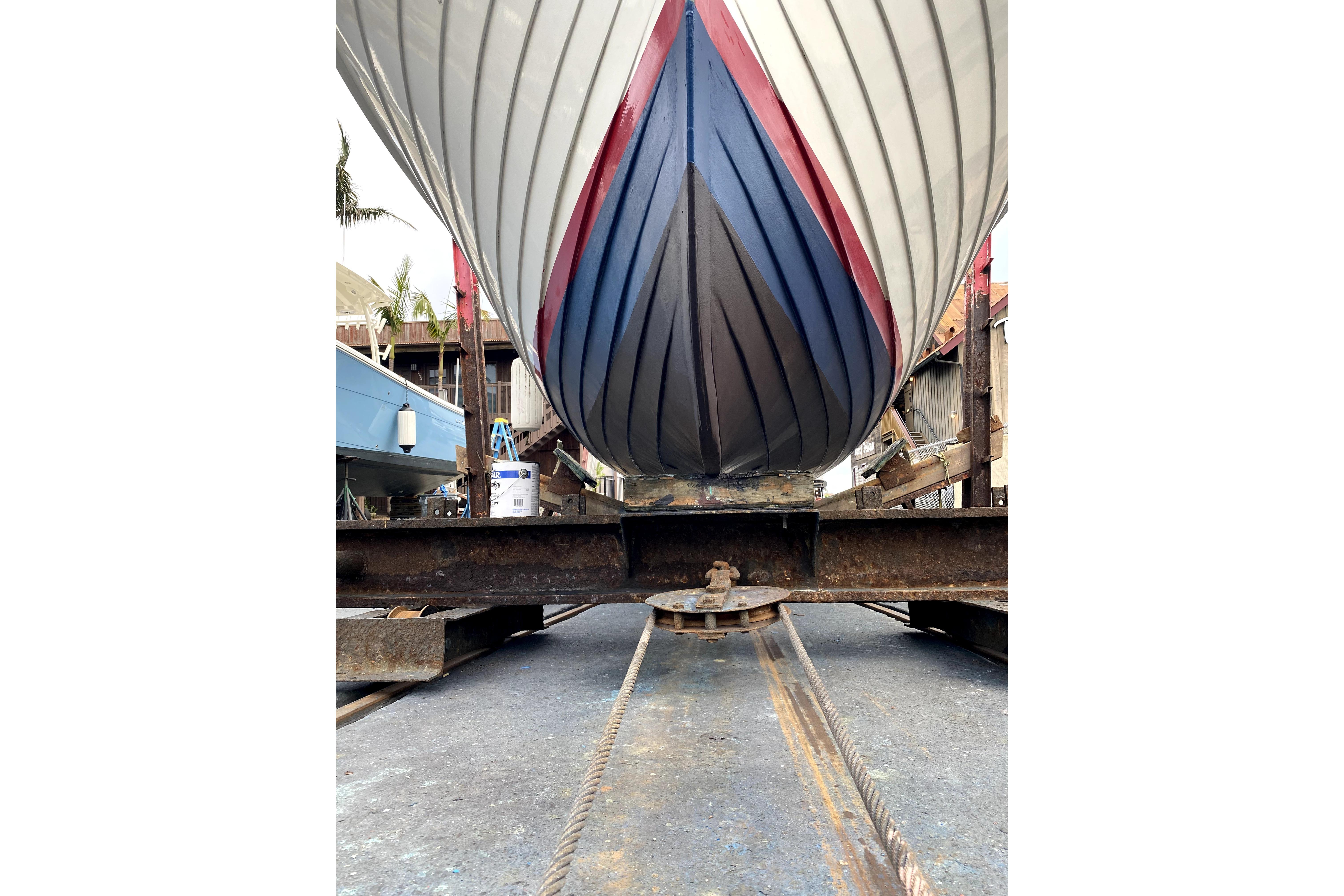 1964 Lyman 25 Sleeper boat on dry dock, showcasing its hull design.