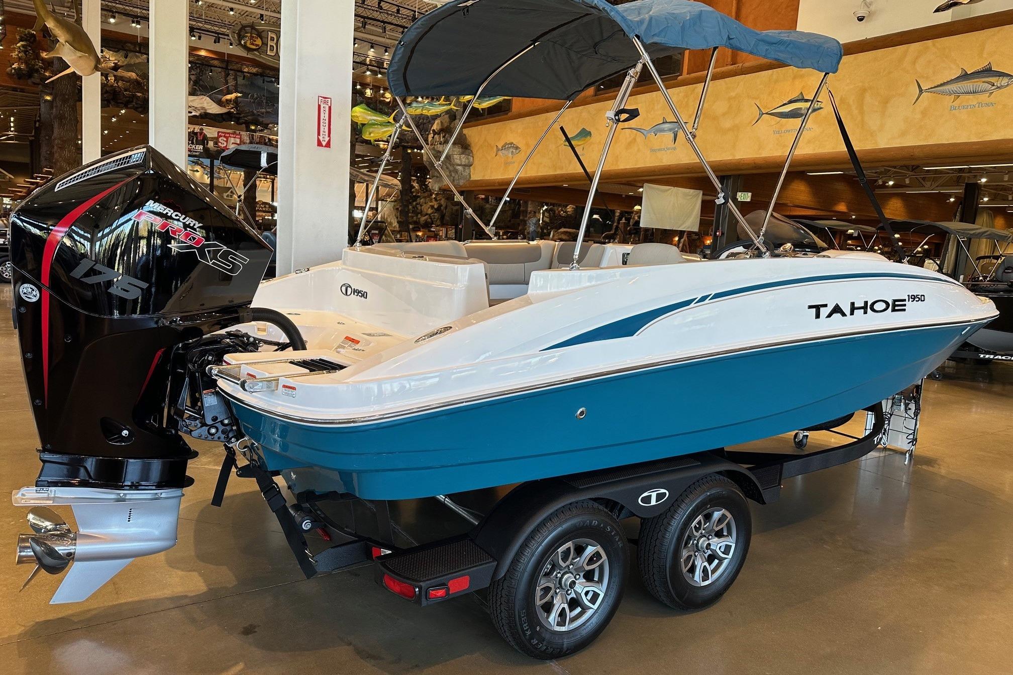 2026 Tahoe 1950 boat with Mercury 175 engine, displayed indoors.