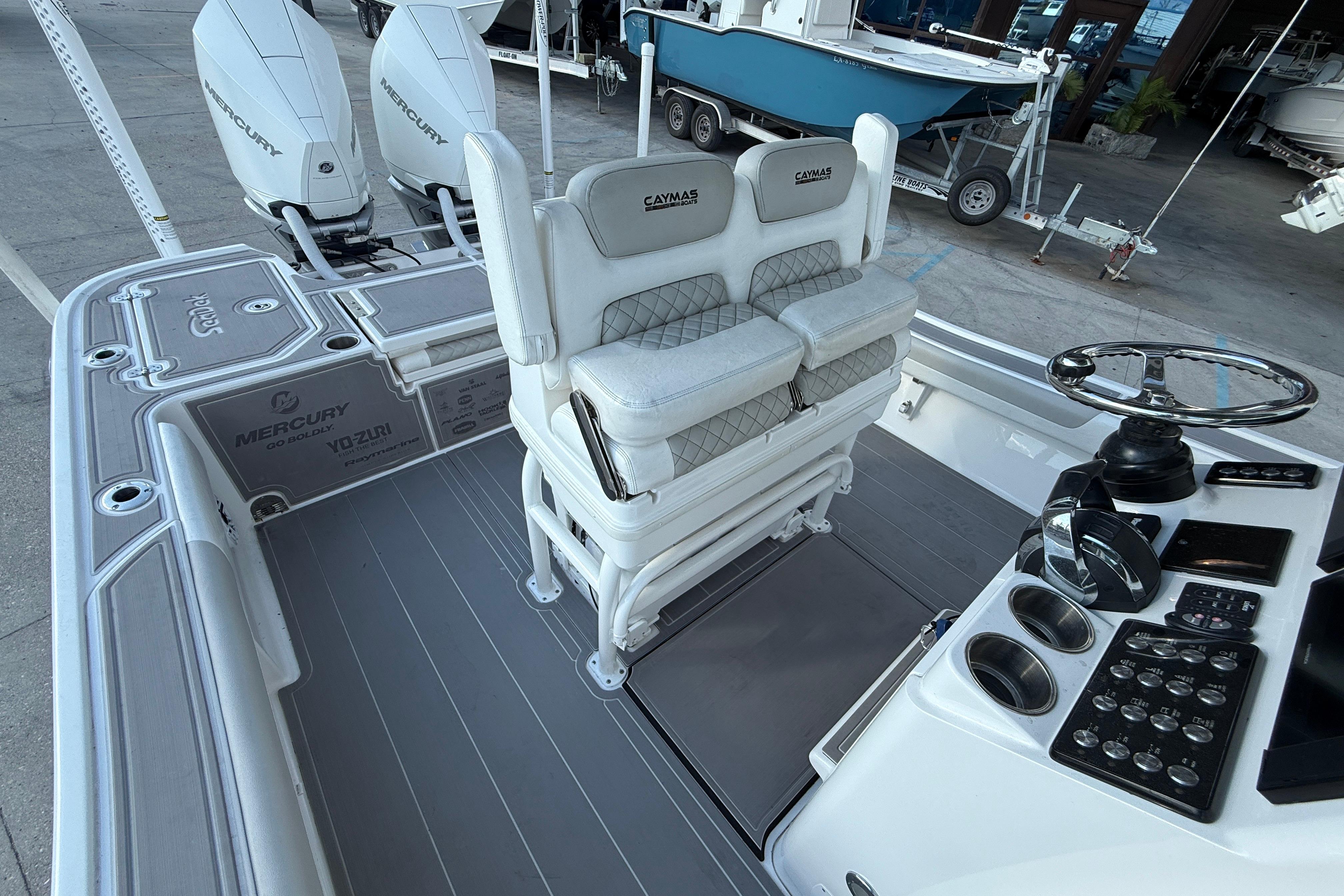 2022 Caymas 28 HB Twin boat interior with dual Mercury engines and modern helm controls.