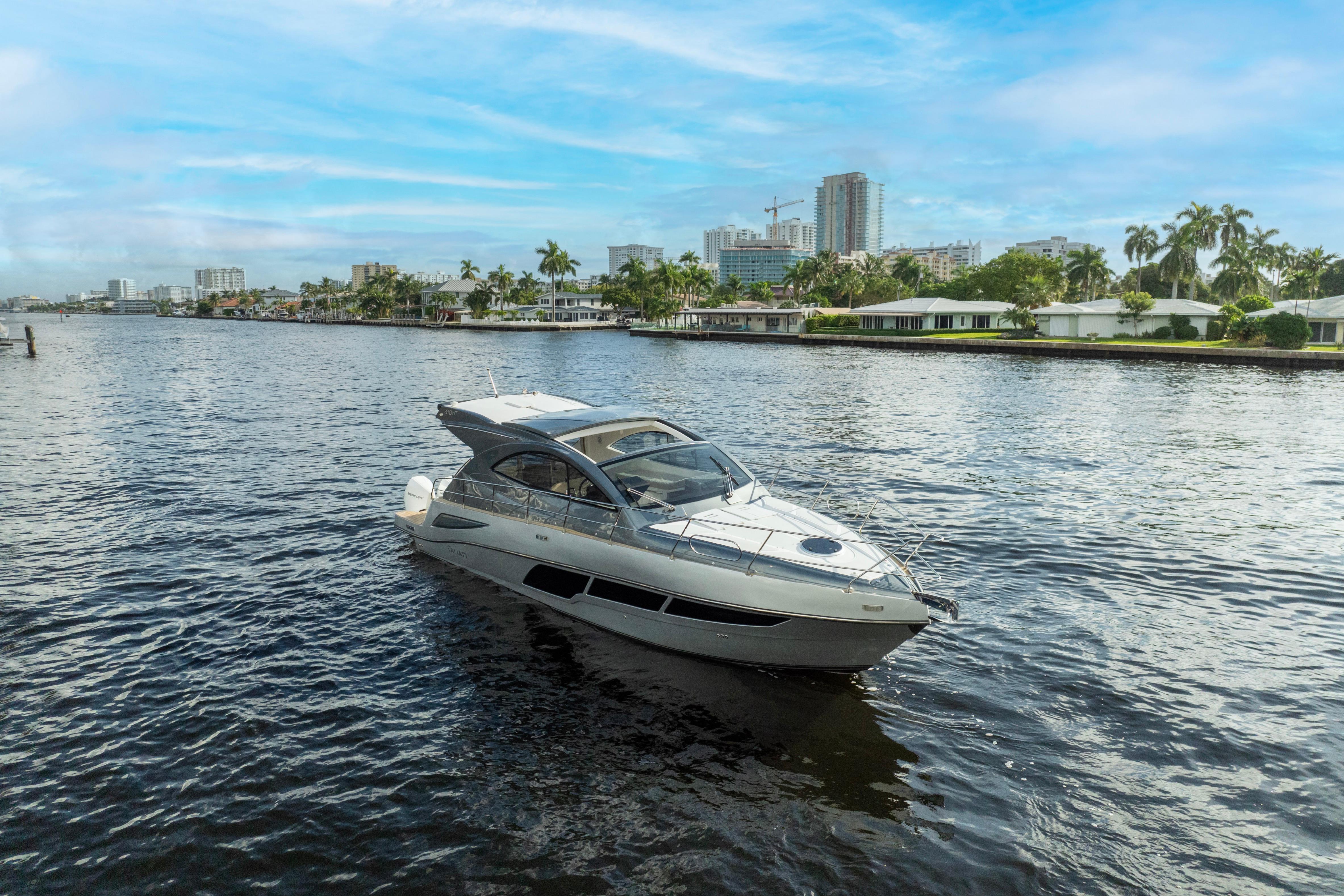 Luxury Valiatt 410HT yacht cruising on a scenic waterway, 2025 model.