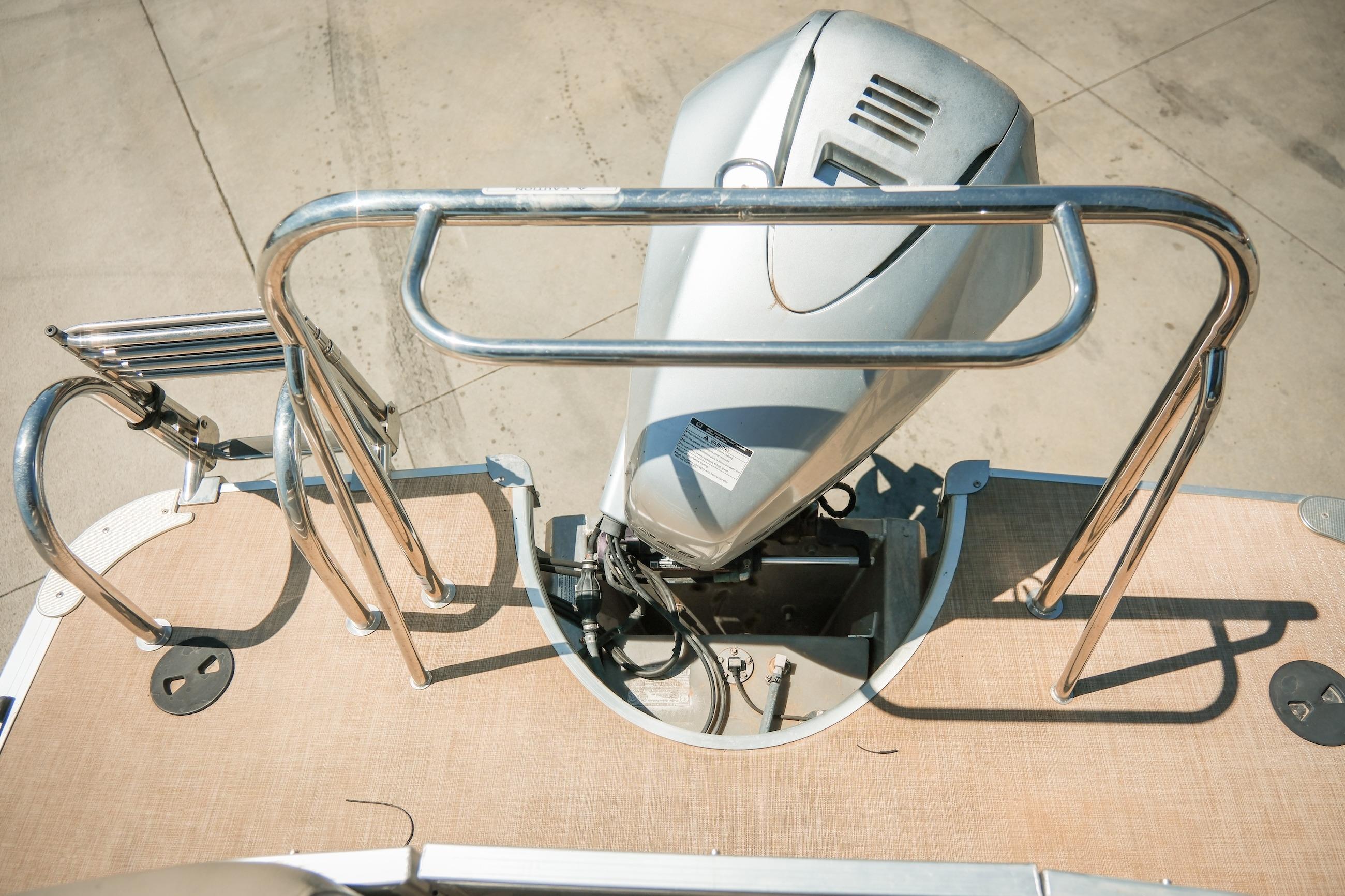 2019 Berkshire 25CLE STS boat engine with stainless steel railings and ladder on deck.