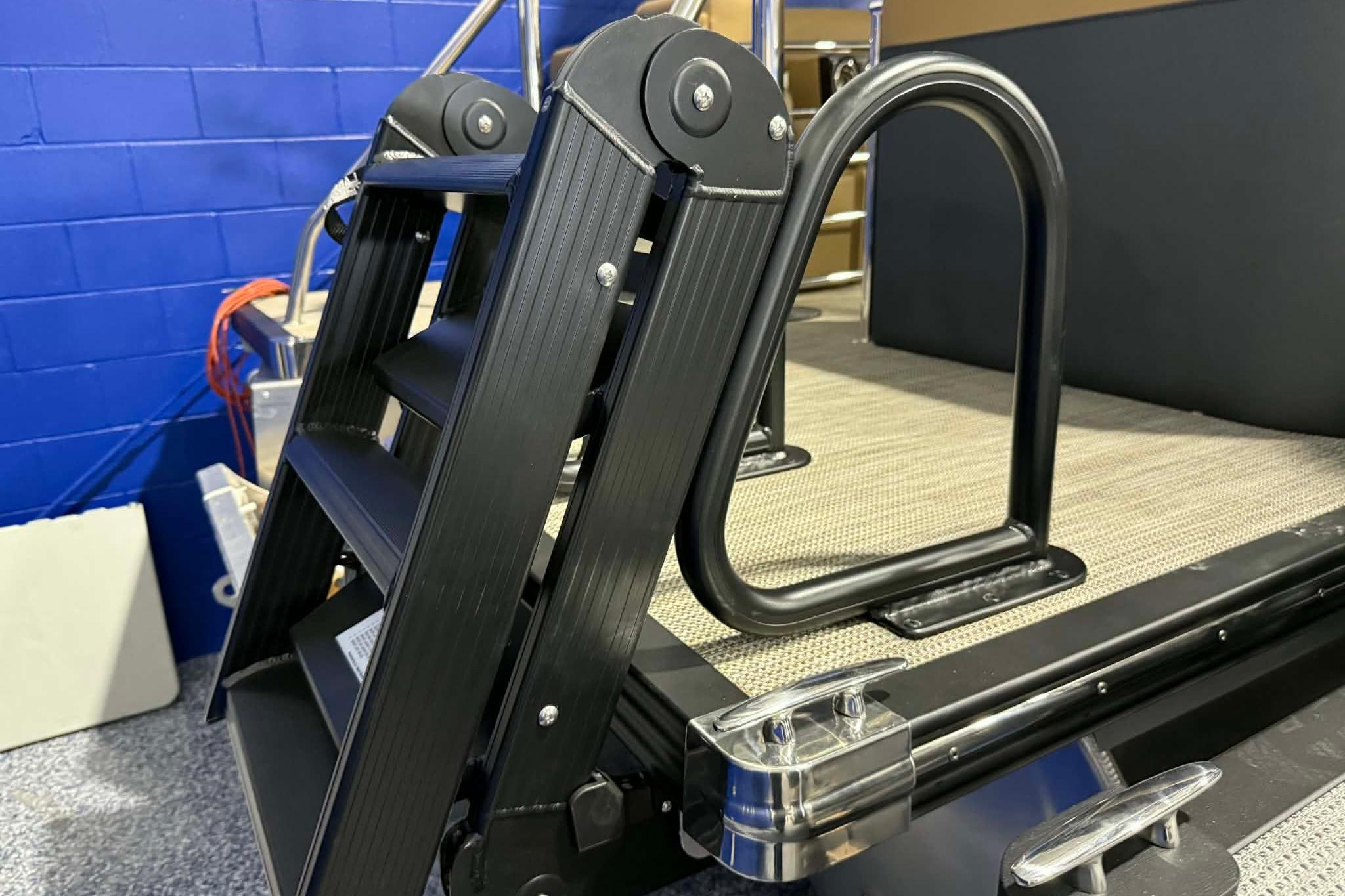 2026 Manitou Encore VP 230 boat ladder and deck detail.
