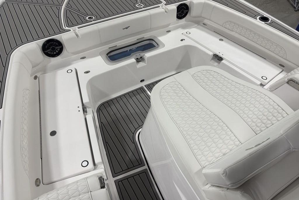 2026 Tidewater 3100 Carolina Bay boat interior with white seating and gray flooring.
