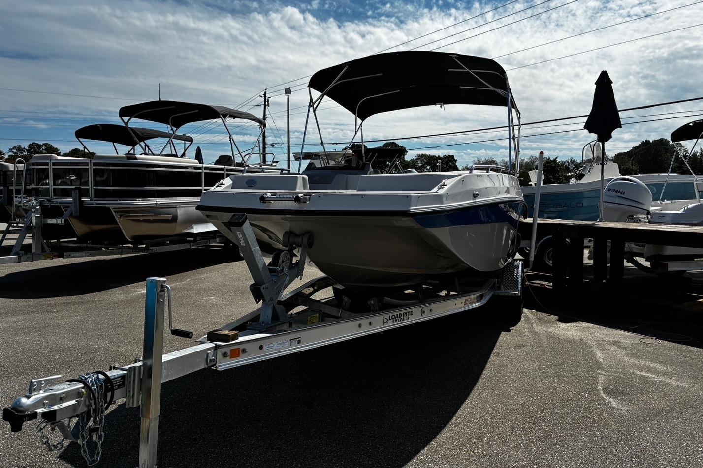 2026 Starcraft SVX 191 OB boat on trailer, displayed outdoors under a partly cloudy sky.